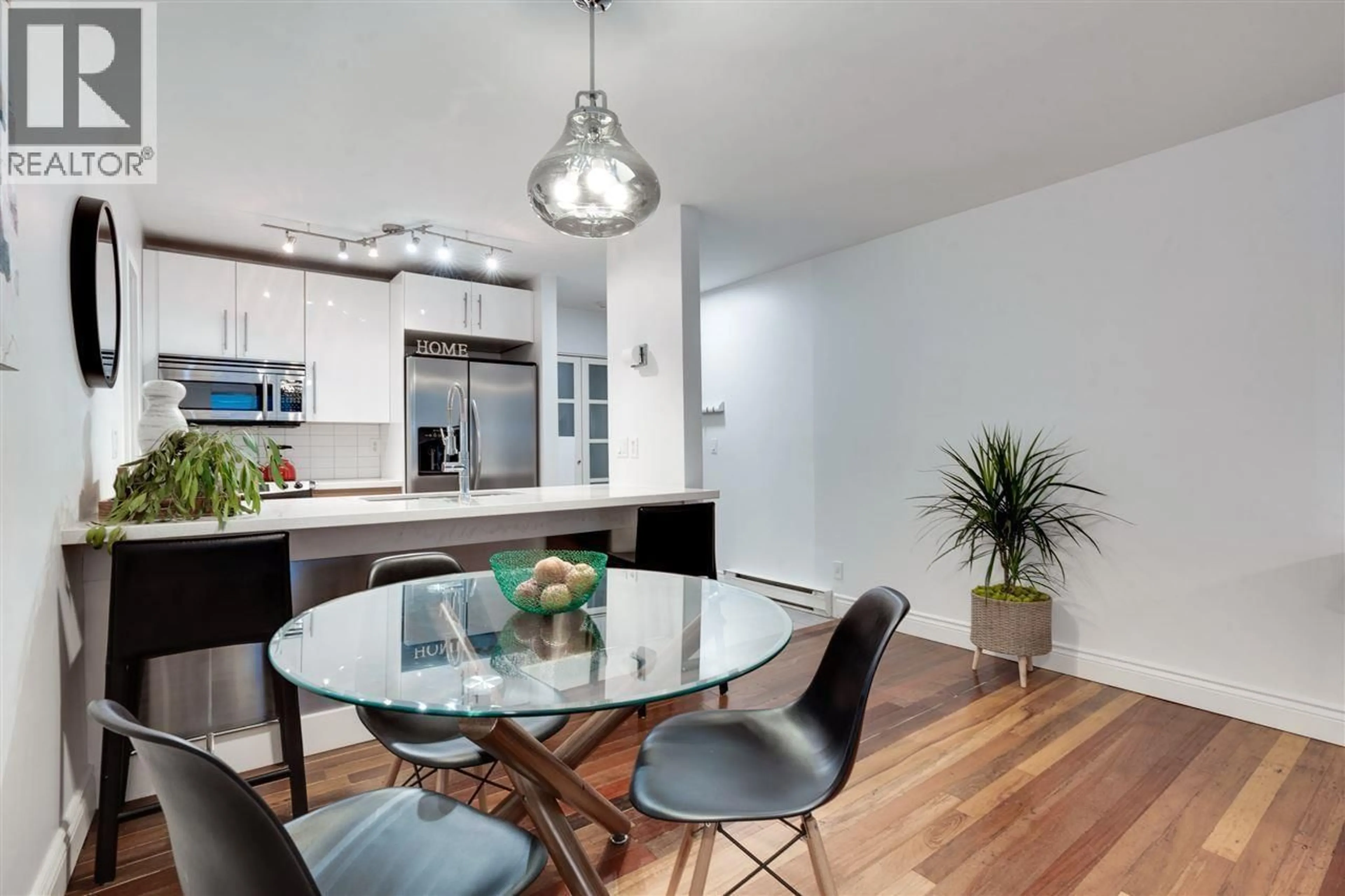 Open concept kitchen, wood/laminate floor for 203 - 1232 HARWOOD STREET, Vancouver British Columbia V6E1S2