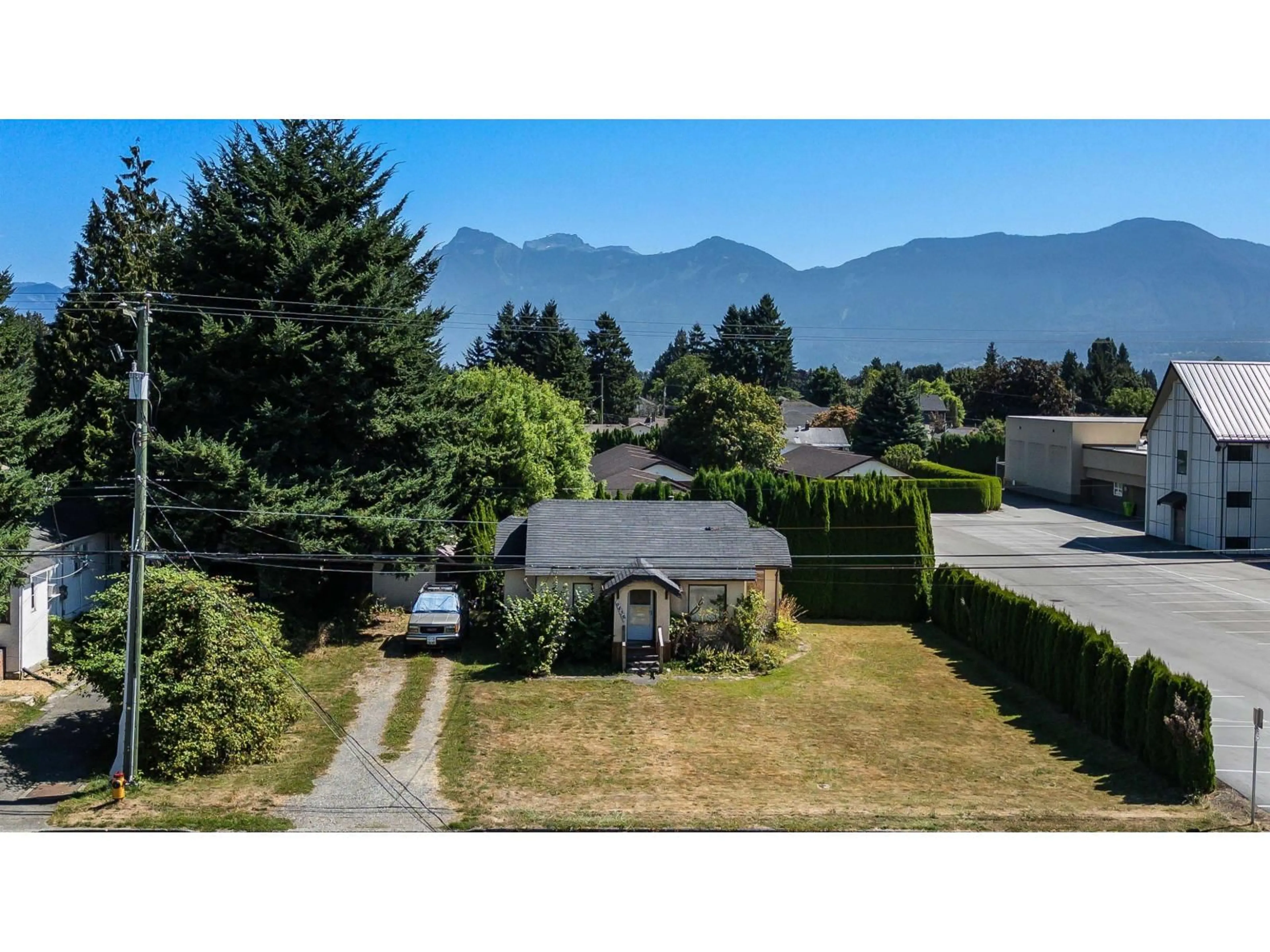 A pic from outside/outdoor area/front of a property/back of a property/a pic from drone, mountain view for 9438 BROADWAY STREET, Chilliwack British Columbia V2P5T9