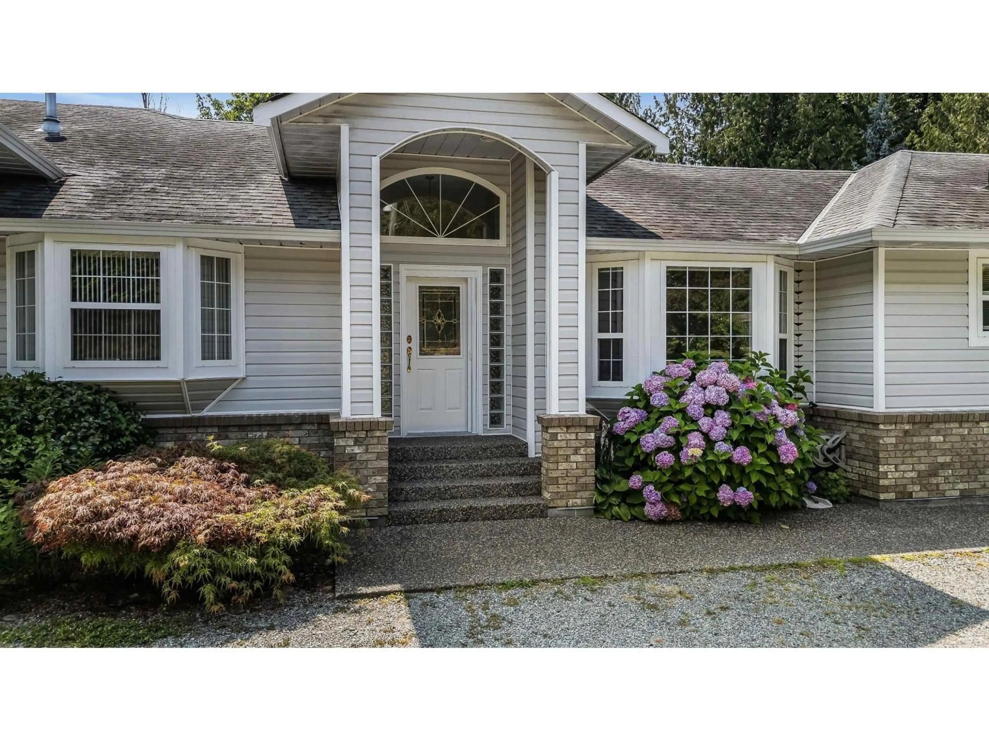 Home with vinyl exterior material, street for 6277 256, Langley British Columbia V4W1K2