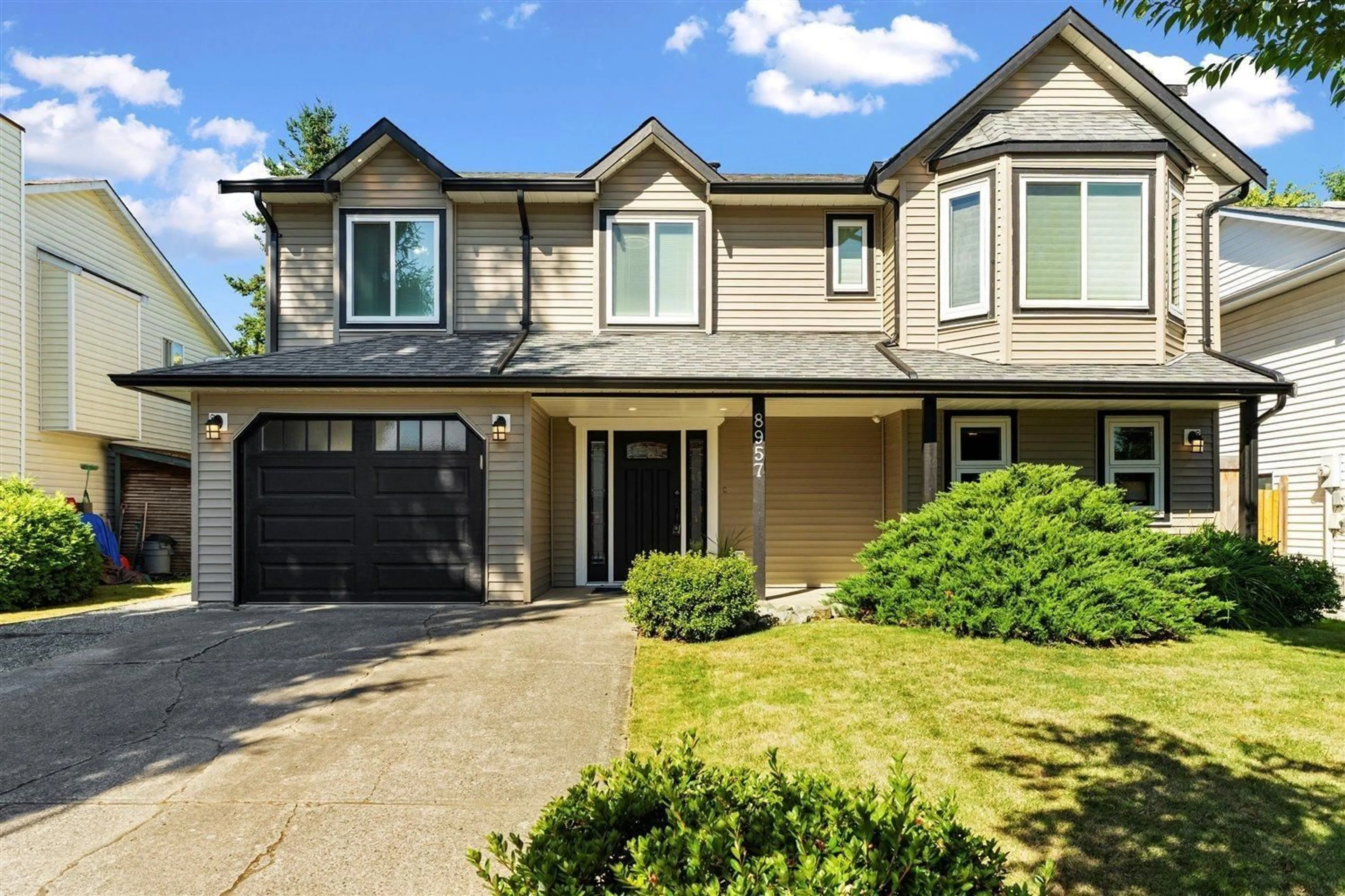 Home with vinyl exterior material, street for 8957 213, Langley British Columbia V1M1Z5