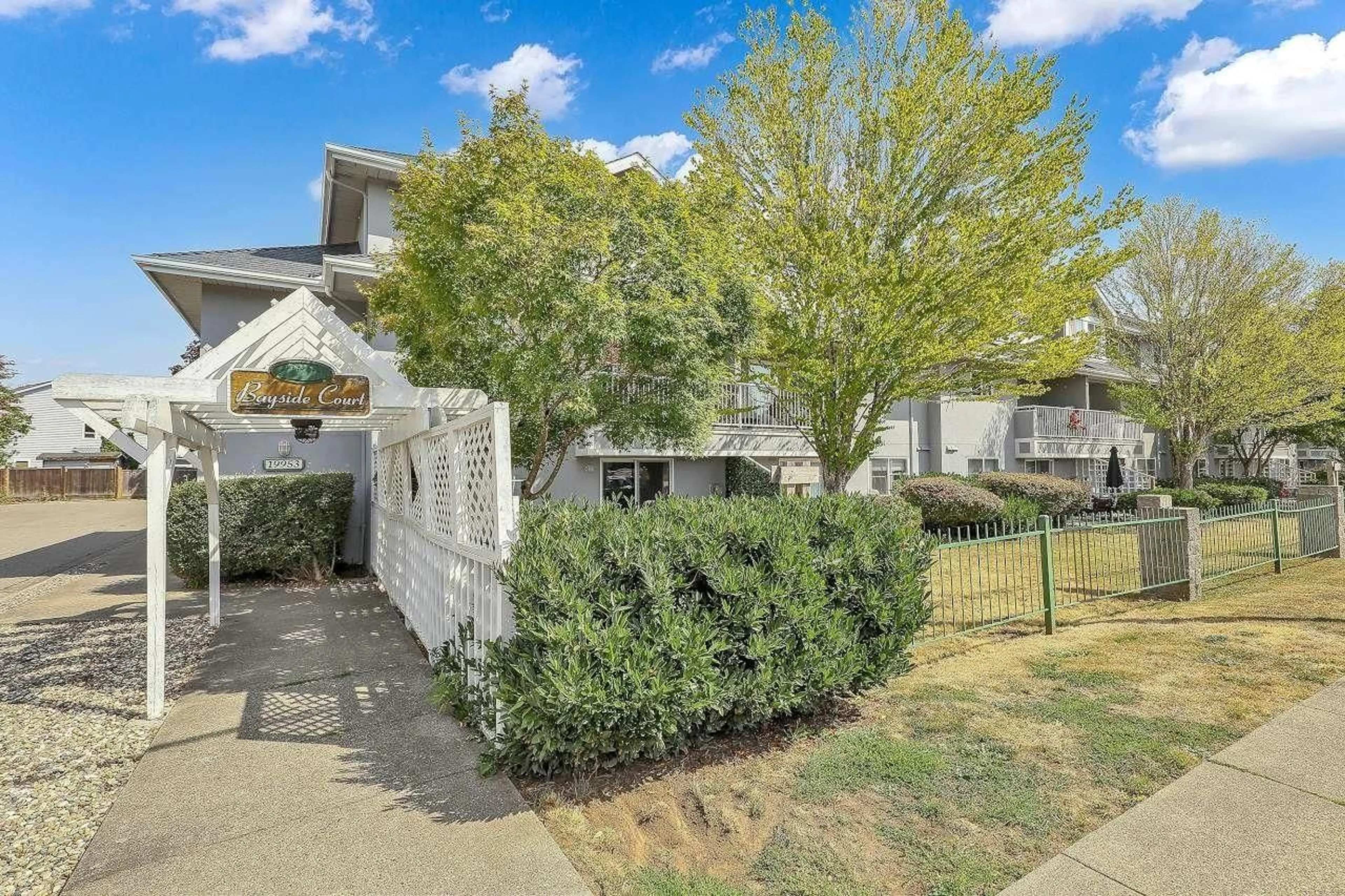 A pic from outside/outdoor area/front of a property/back of a property/a pic from drone, street for 215 - 19953 55A, Langley British Columbia V3A3X4