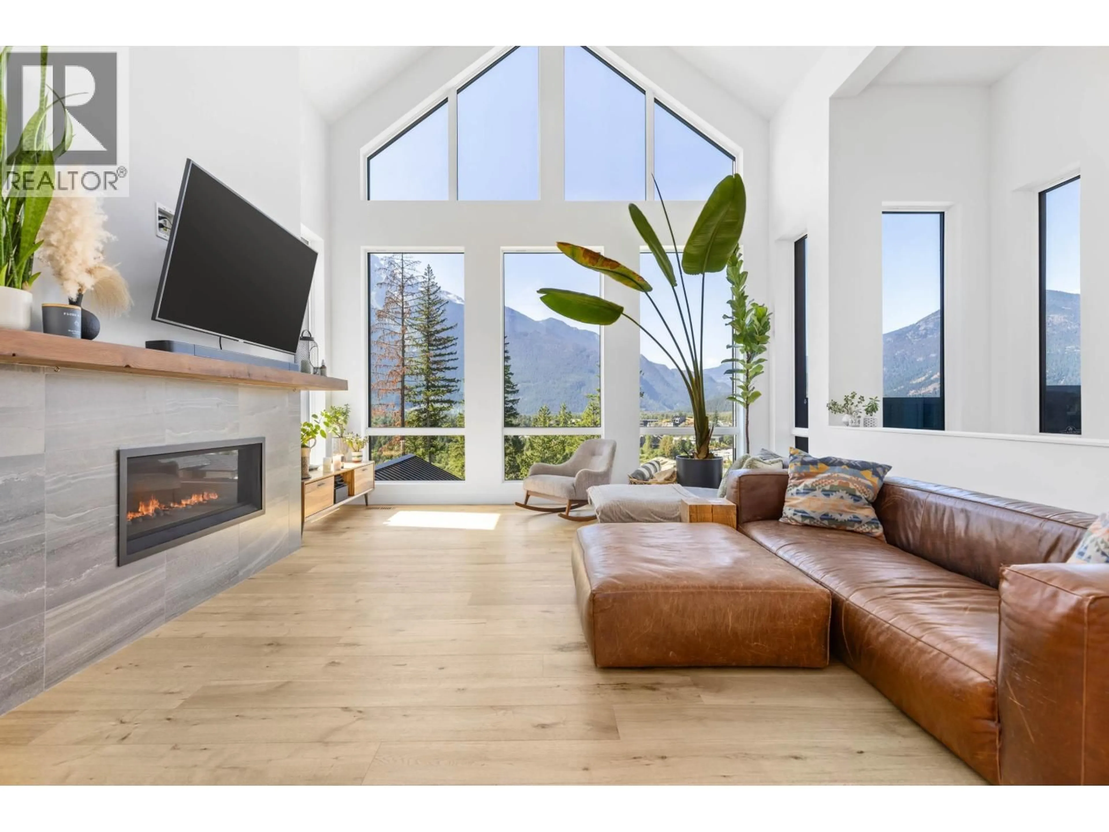 Living room with furniture, wood/laminate floor for 7676 CERULEAN DRIVE, Pemberton British Columbia V0N2L3