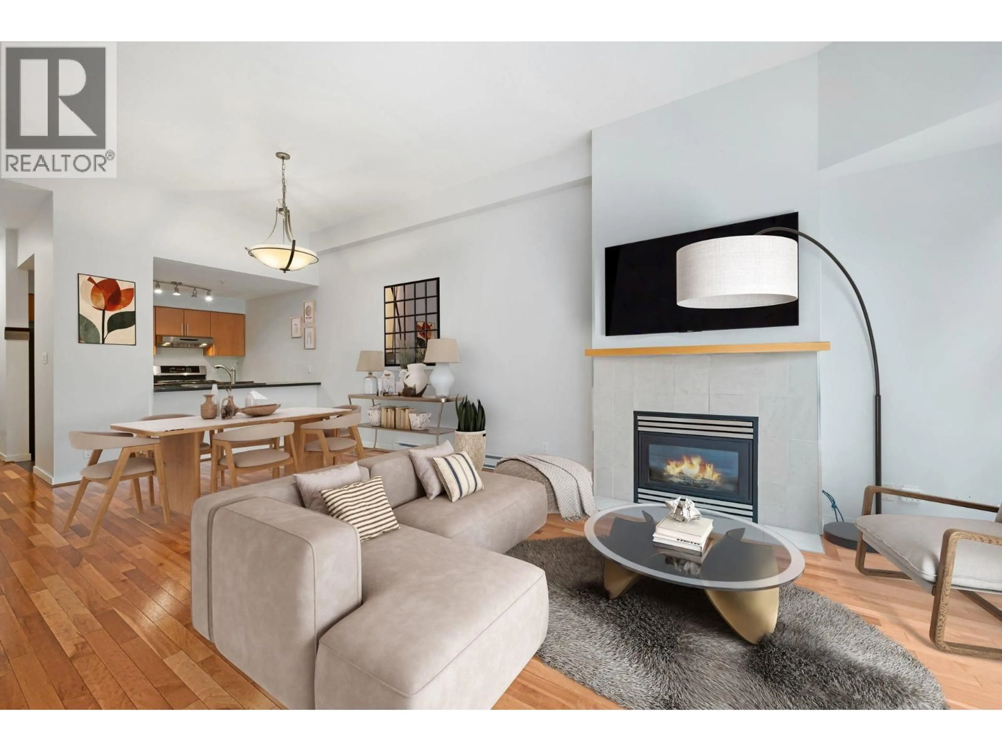 Living room with furniture, wood/laminate floor for 133 AQUARIUS MEWS, Vancouver British Columbia V6Z2Z1