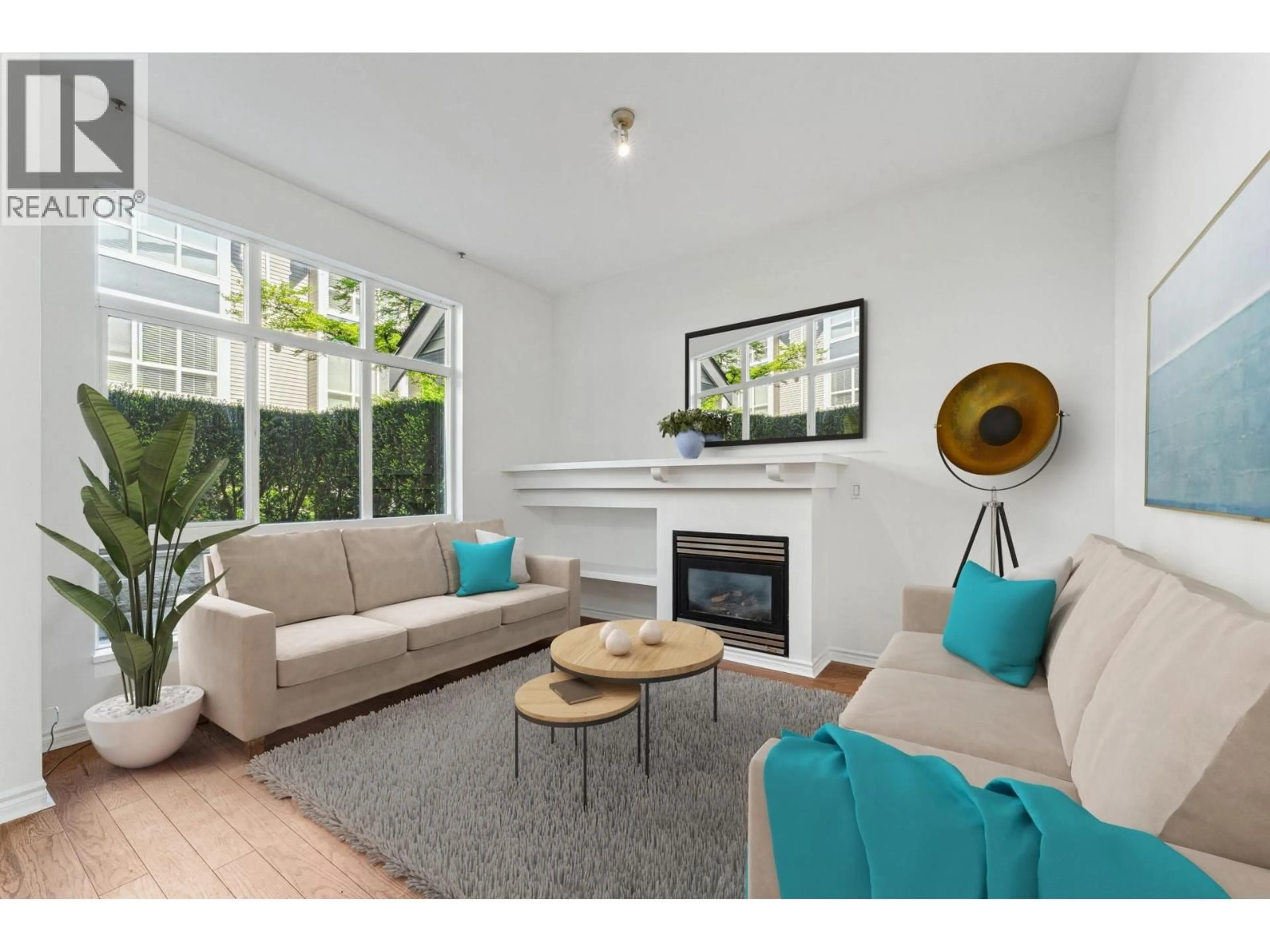 Living room with furniture, wood/laminate floor for 1 - 995 LYNN VALLEY ROAD, North Vancouver British Columbia V7J1Z6