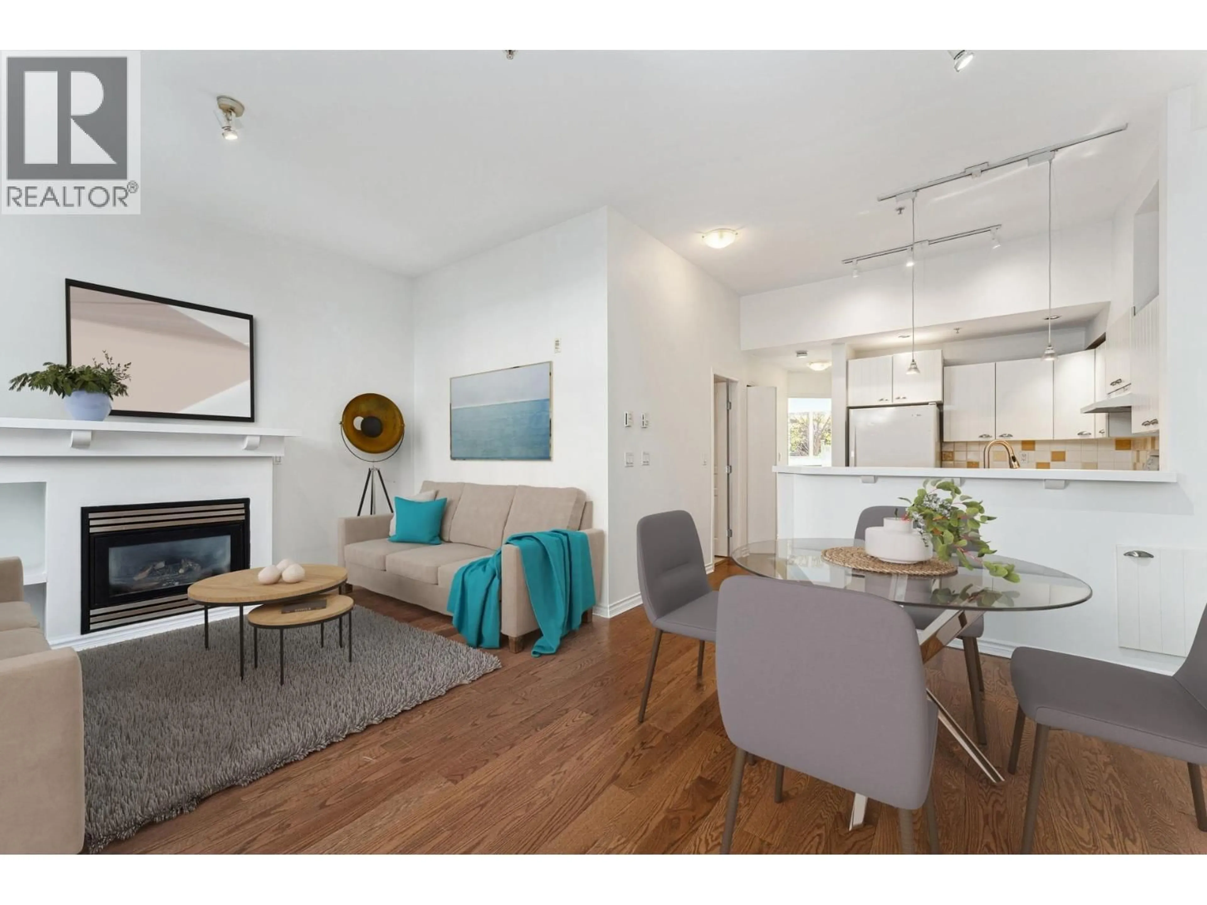 Living room with furniture, wood/laminate floor for 1 - 995 LYNN VALLEY ROAD, North Vancouver British Columbia V7J1Z6