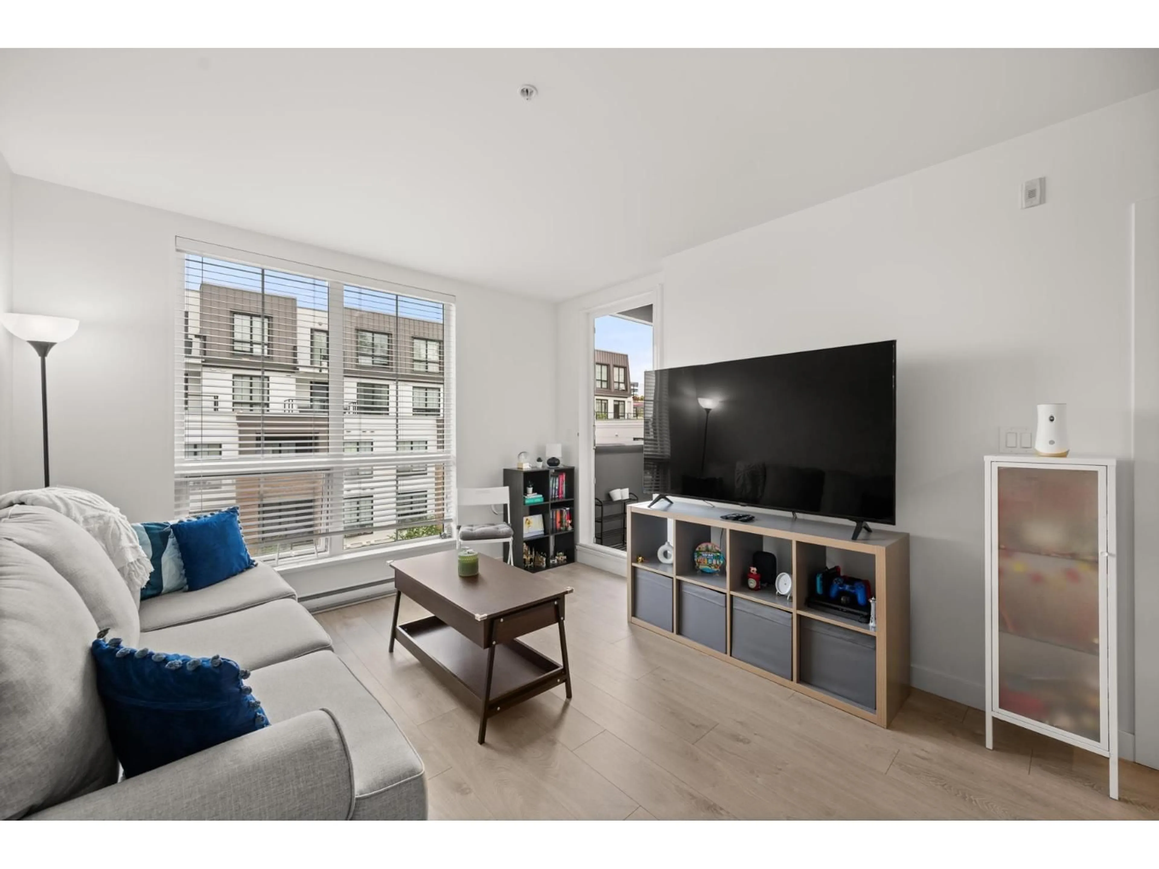Living room with furniture, wood/laminate floor for D408 - 8327 201, Langley British Columbia V2Y3P5