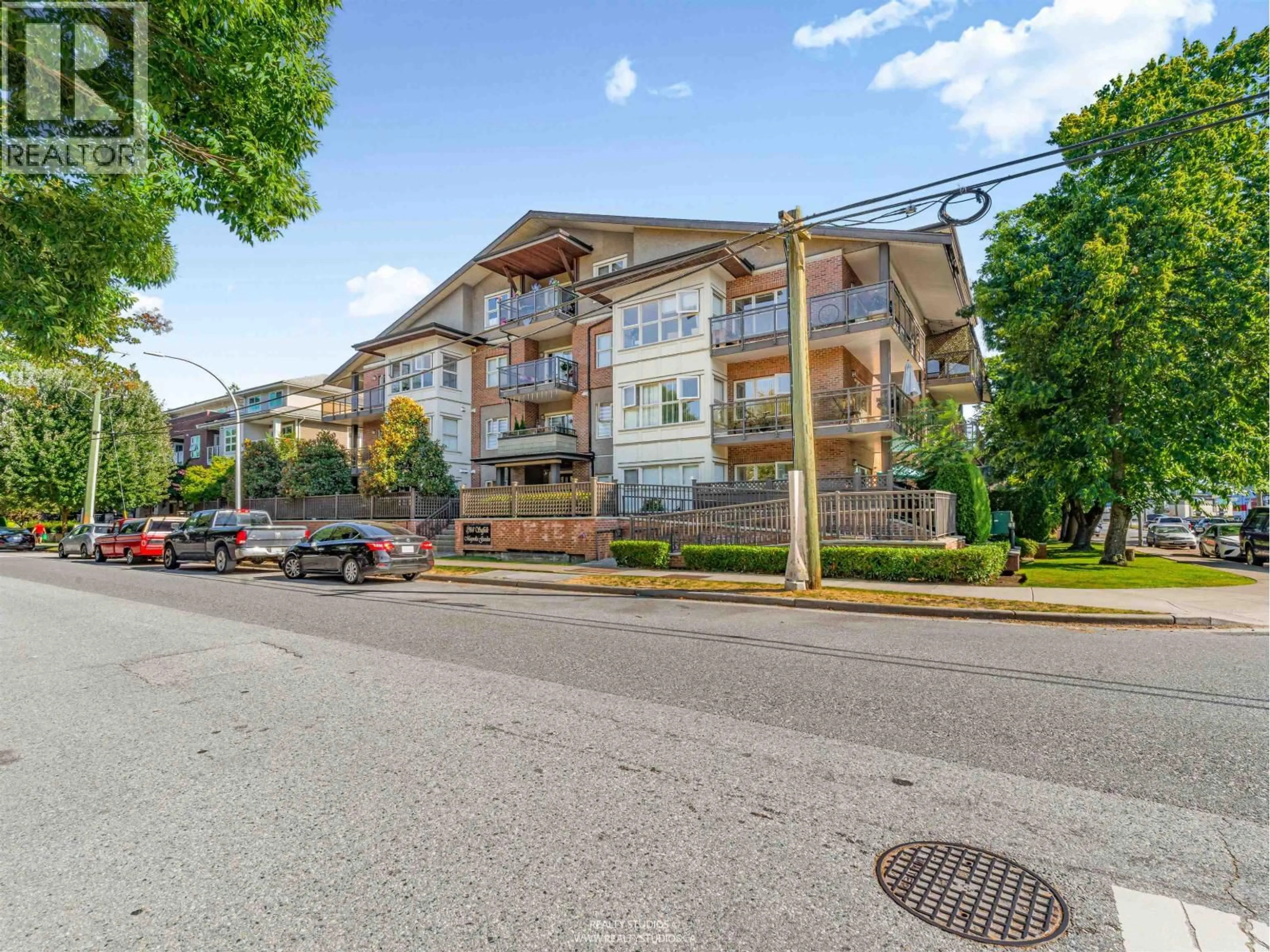 A pic from outside/outdoor area/front of a property/back of a property/a pic from drone, mountain view for 208 - 1988 SUFFOLK AVENUE, Port Coquitlam British Columbia V3B1H2