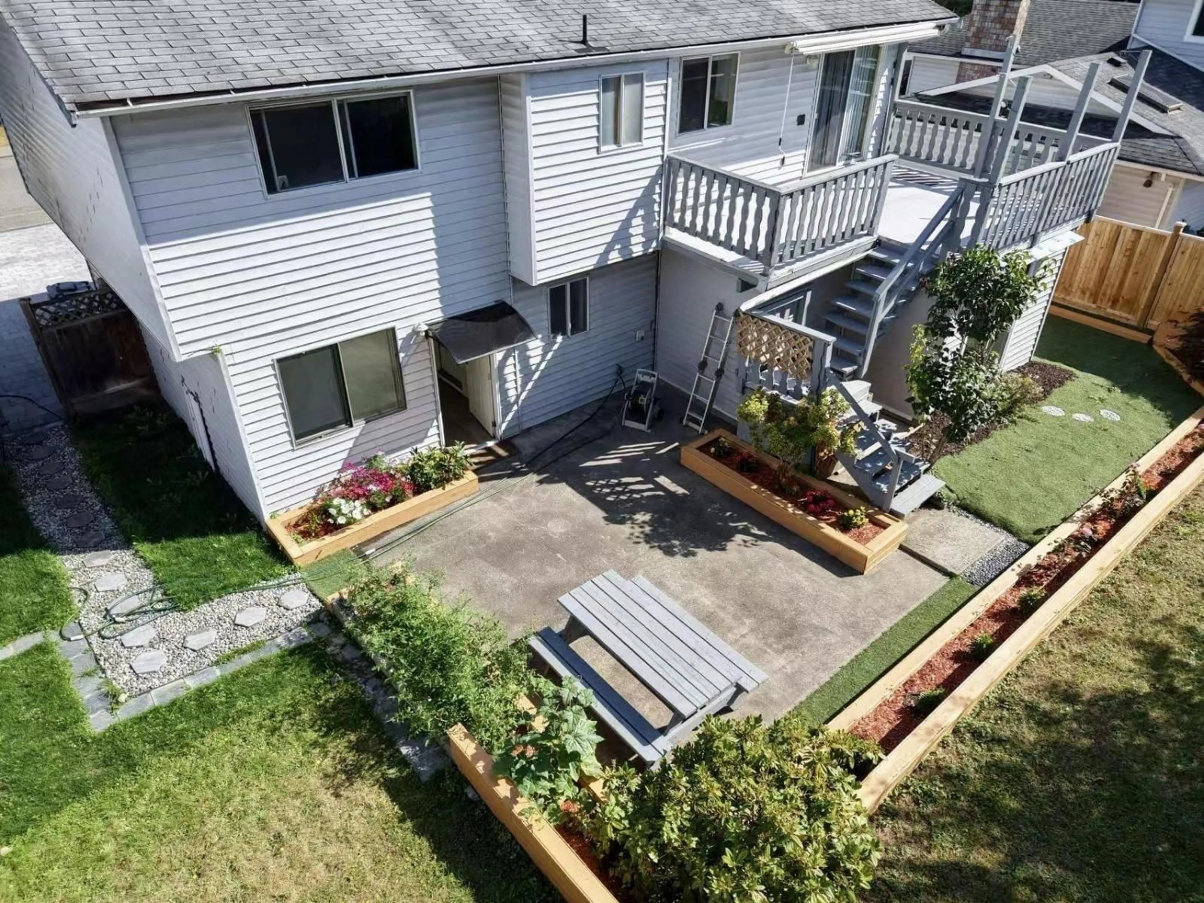A pic from outside/outdoor area/front of a property/back of a property/a pic from drone, unknown for 21218 93, Langley British Columbia V1M1K3