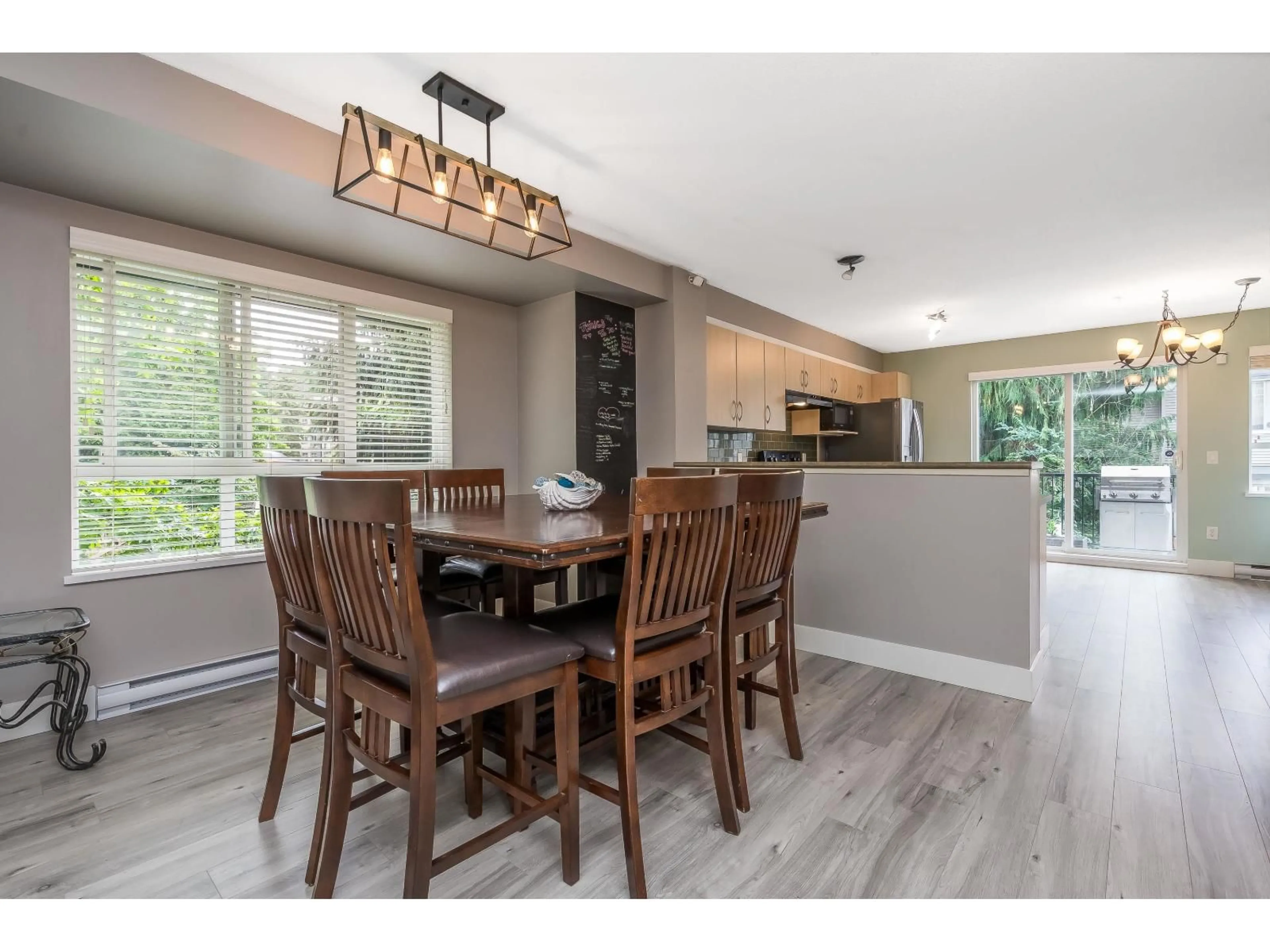 Open concept kitchen, wood/laminate floor for 1 - 6747 203, Langley British Columbia V2Y3B5