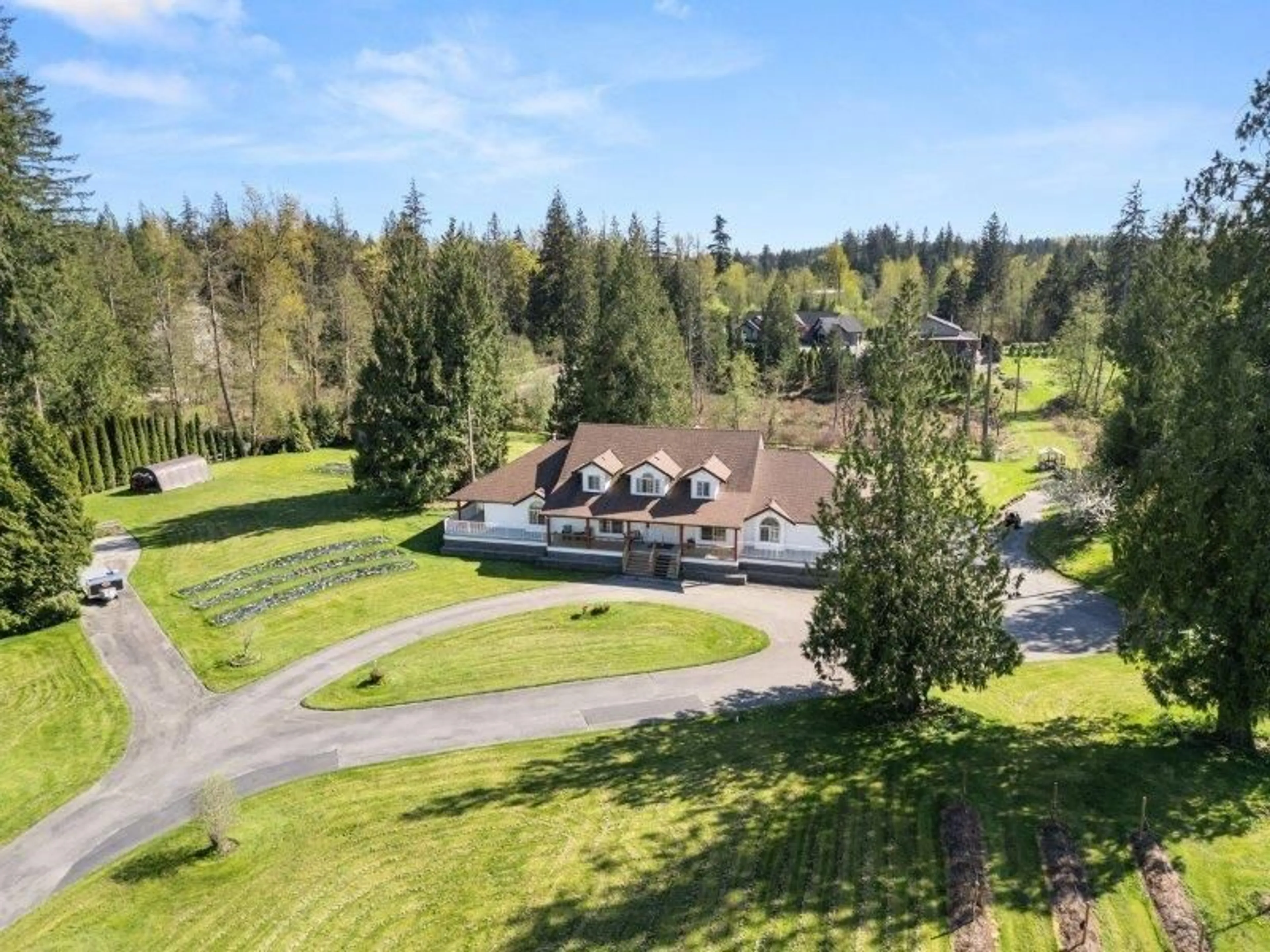 A pic from outside/outdoor area/front of a property/back of a property/a pic from drone, unknown for 21980 100, Langley British Columbia V1M3V1