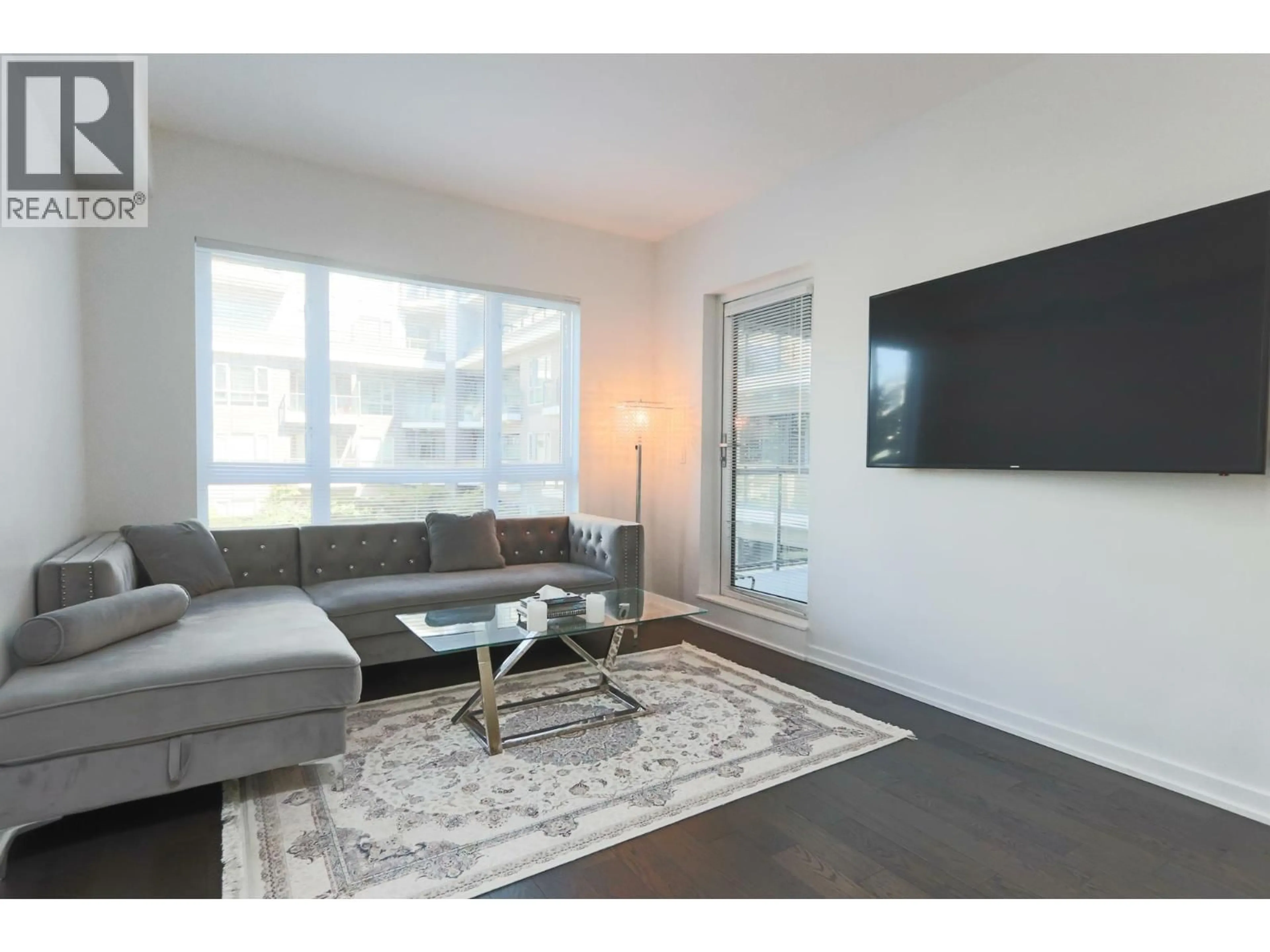 Living room with furniture, wood/laminate floor for 321 - 7008 RIVER PARKWAY, Richmond British Columbia V6X0R1