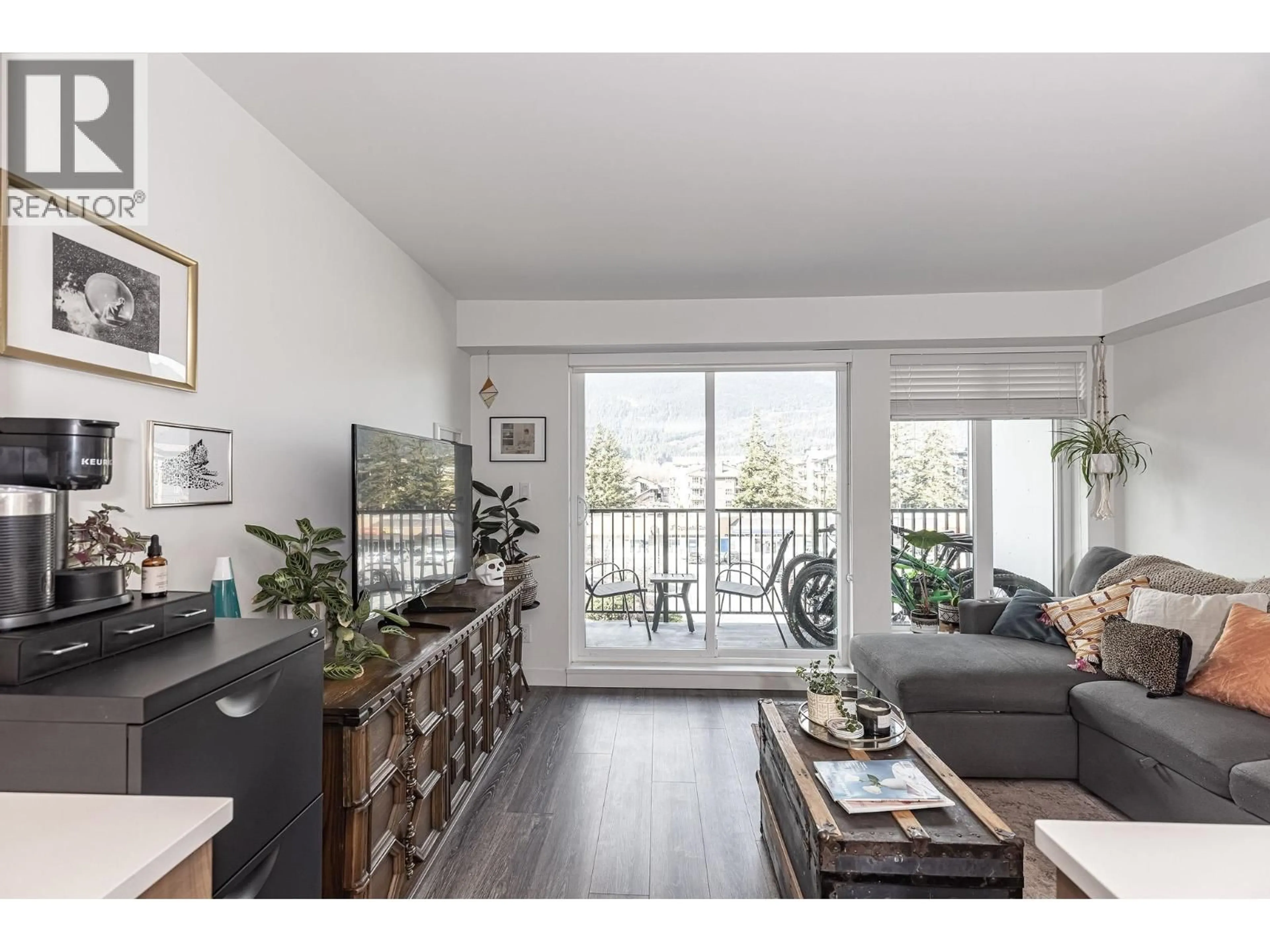 Living room with furniture, wood/laminate floor for 307 - 1365 PEMBERTON AVENUE, Squamish British Columbia V8B1B7
