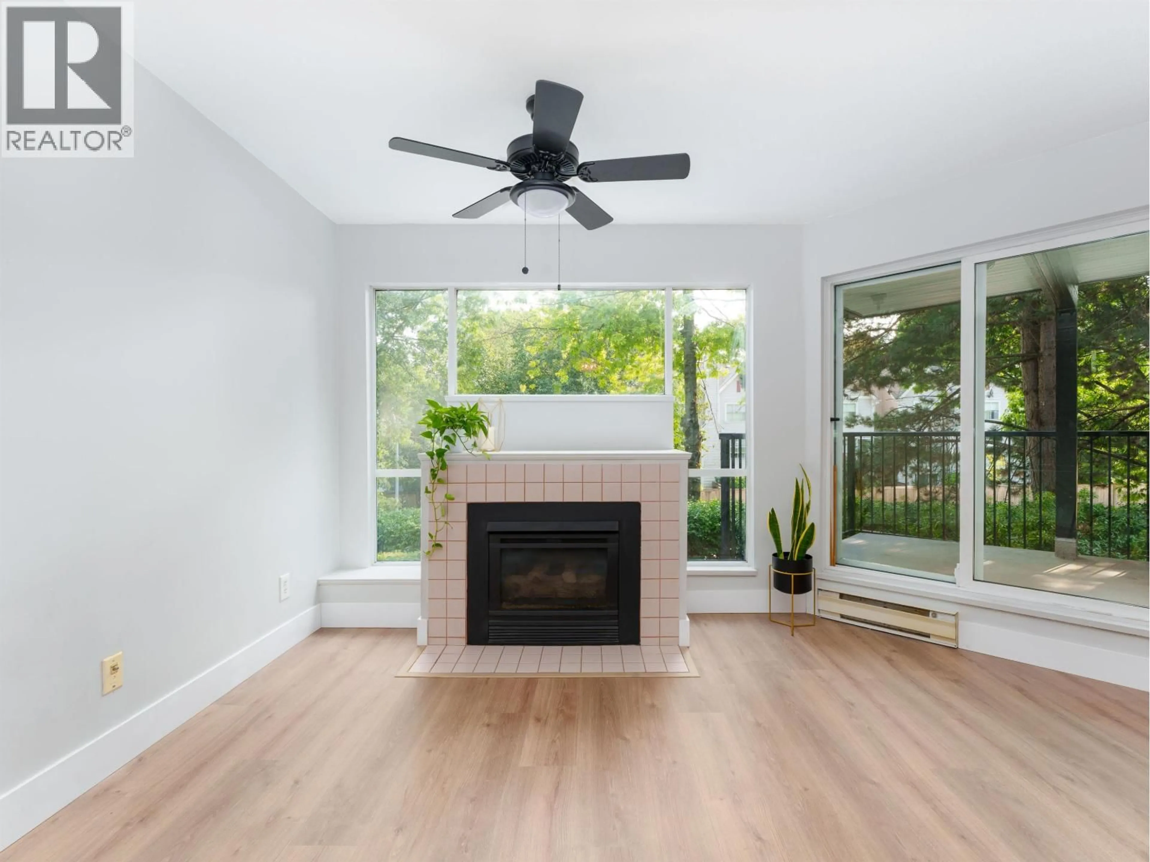 Living room with furniture, wood/laminate floor for 208 - 2429 HAWTHORNE AVENUE, Port Coquitlam British Columbia V3C6G6