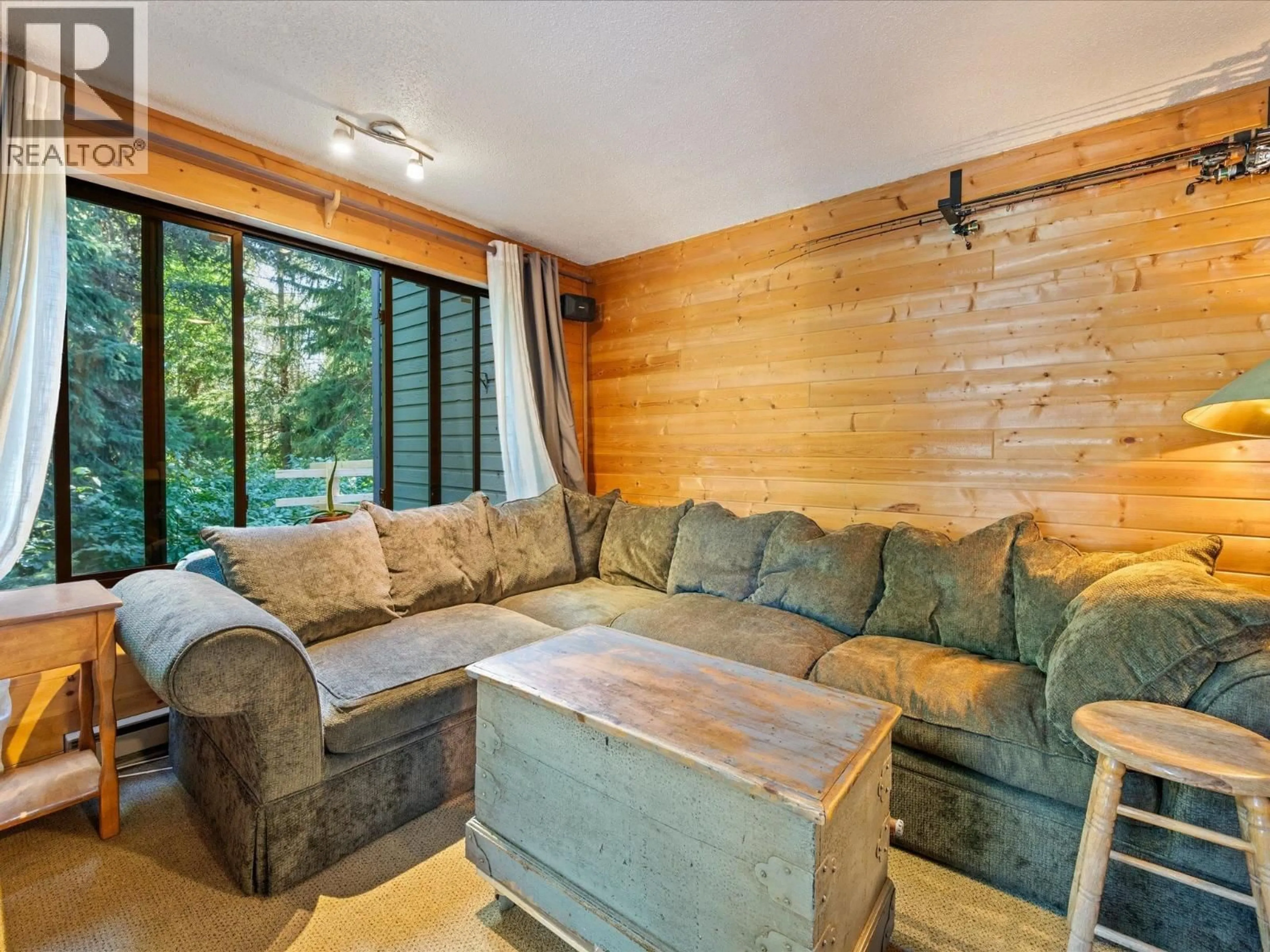 Living room with furniture, wood/laminate floor for 108 - 6850 CRABAPPLE DRIVE, Whistler British Columbia V8E0C5