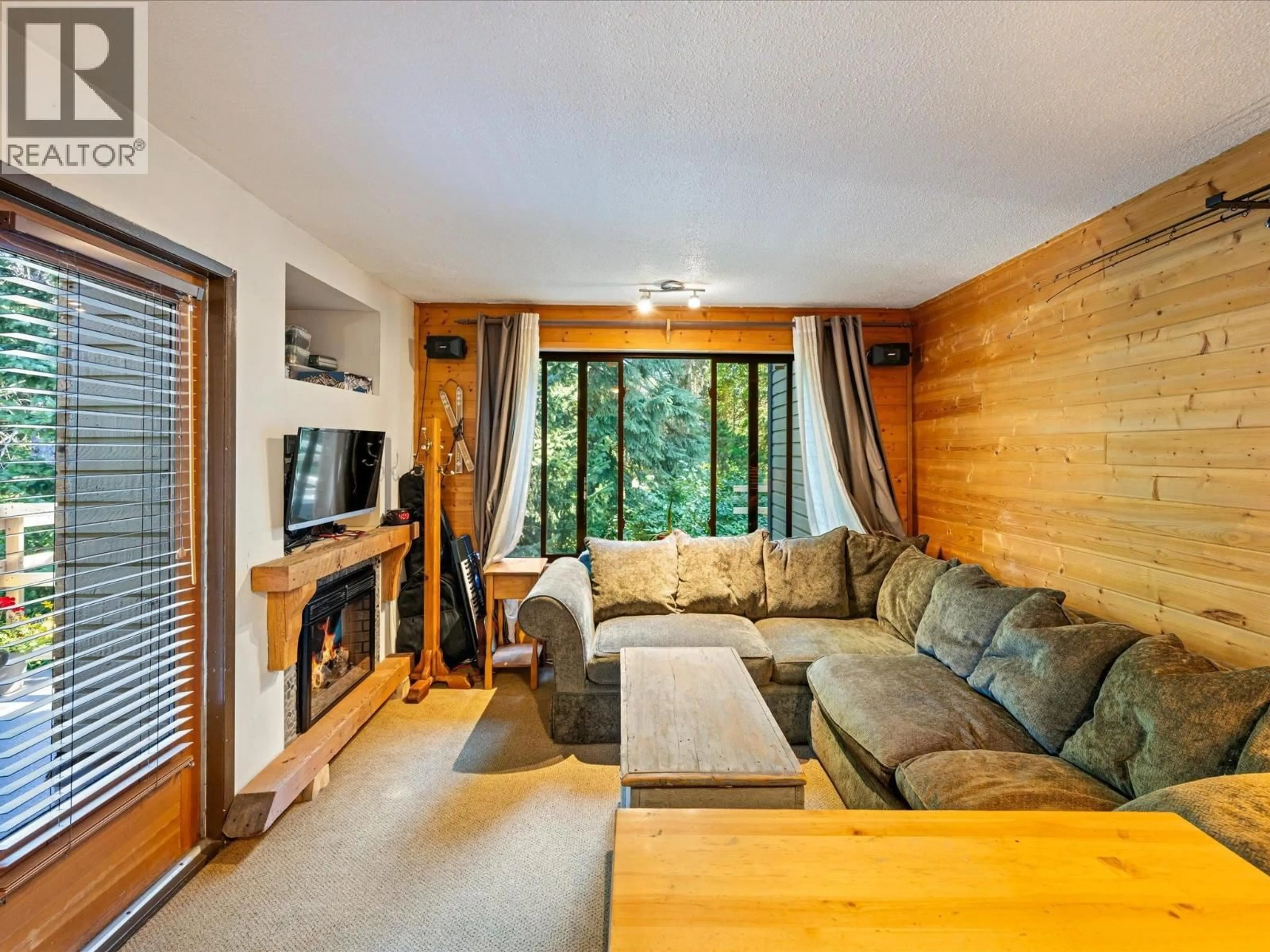 Living room with furniture, wood/laminate floor for 108 - 6850 CRABAPPLE DRIVE, Whistler British Columbia V8E0C5