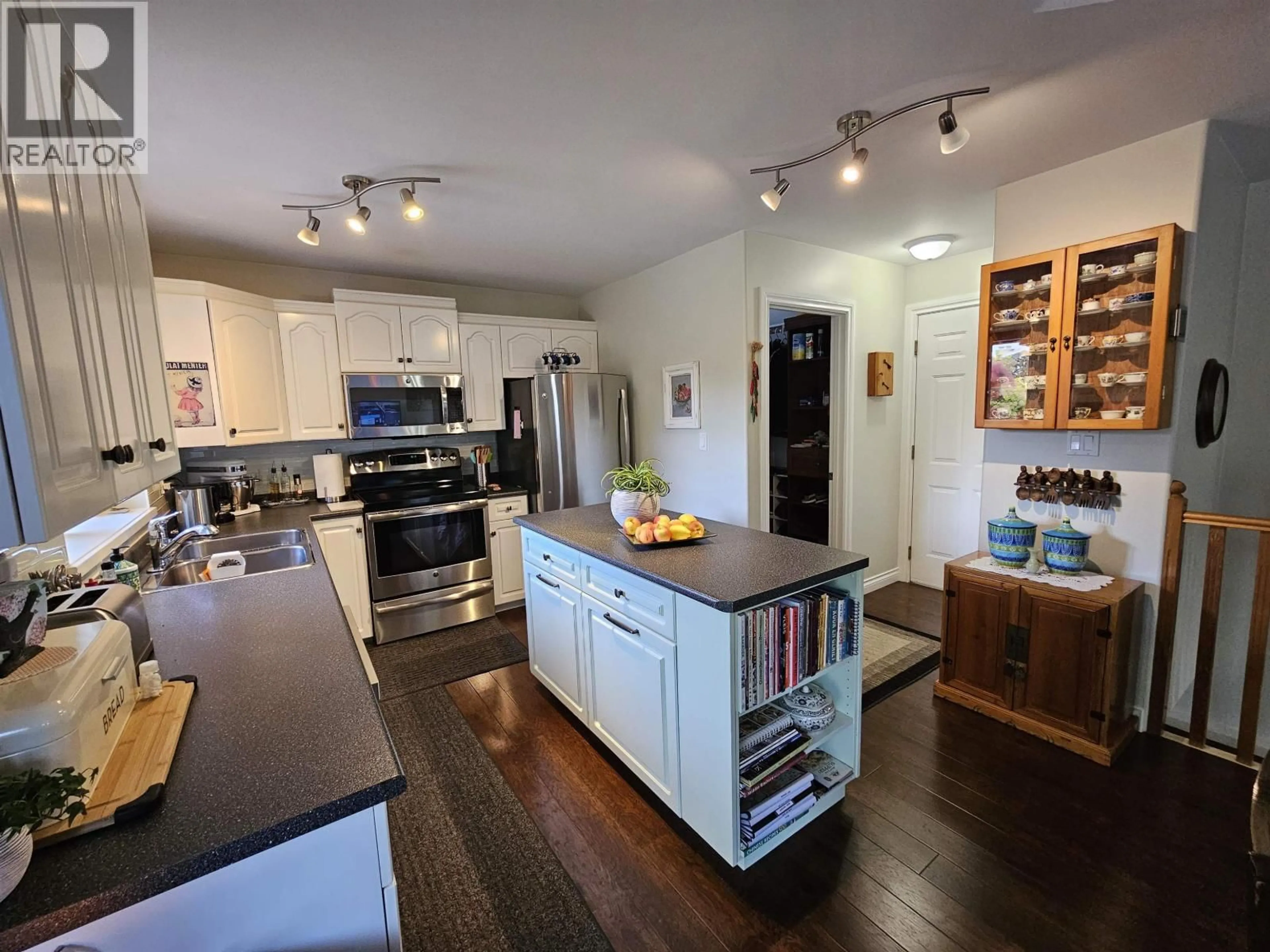 Open concept kitchen, wood/laminate floor for 3821 HATTON STREET, Terrace British Columbia V8G5P6