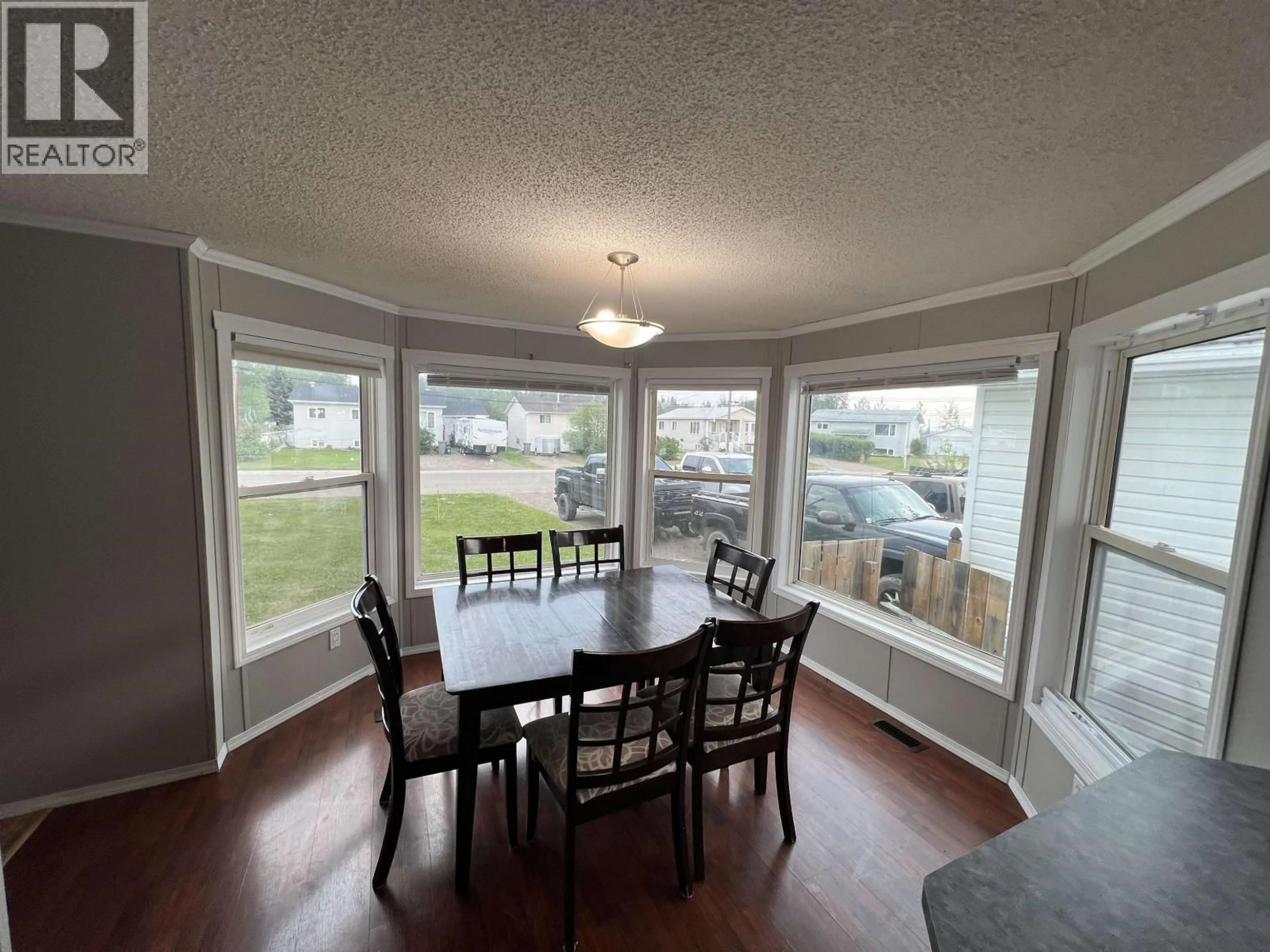 Dining room, wood/laminate floor for 5207 COTTONWOOD ROAD, Fort Nelson British Columbia V0C1R0