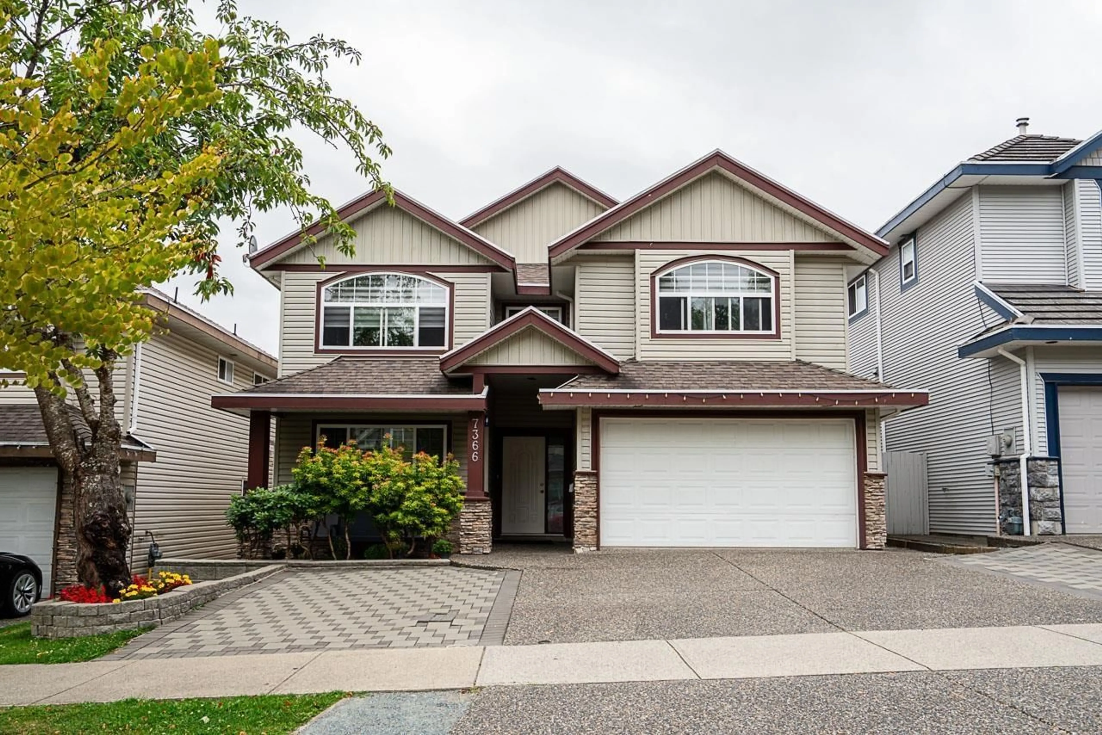 Home with vinyl exterior material, street for 7366 144A, Surrey British Columbia V3S0M9