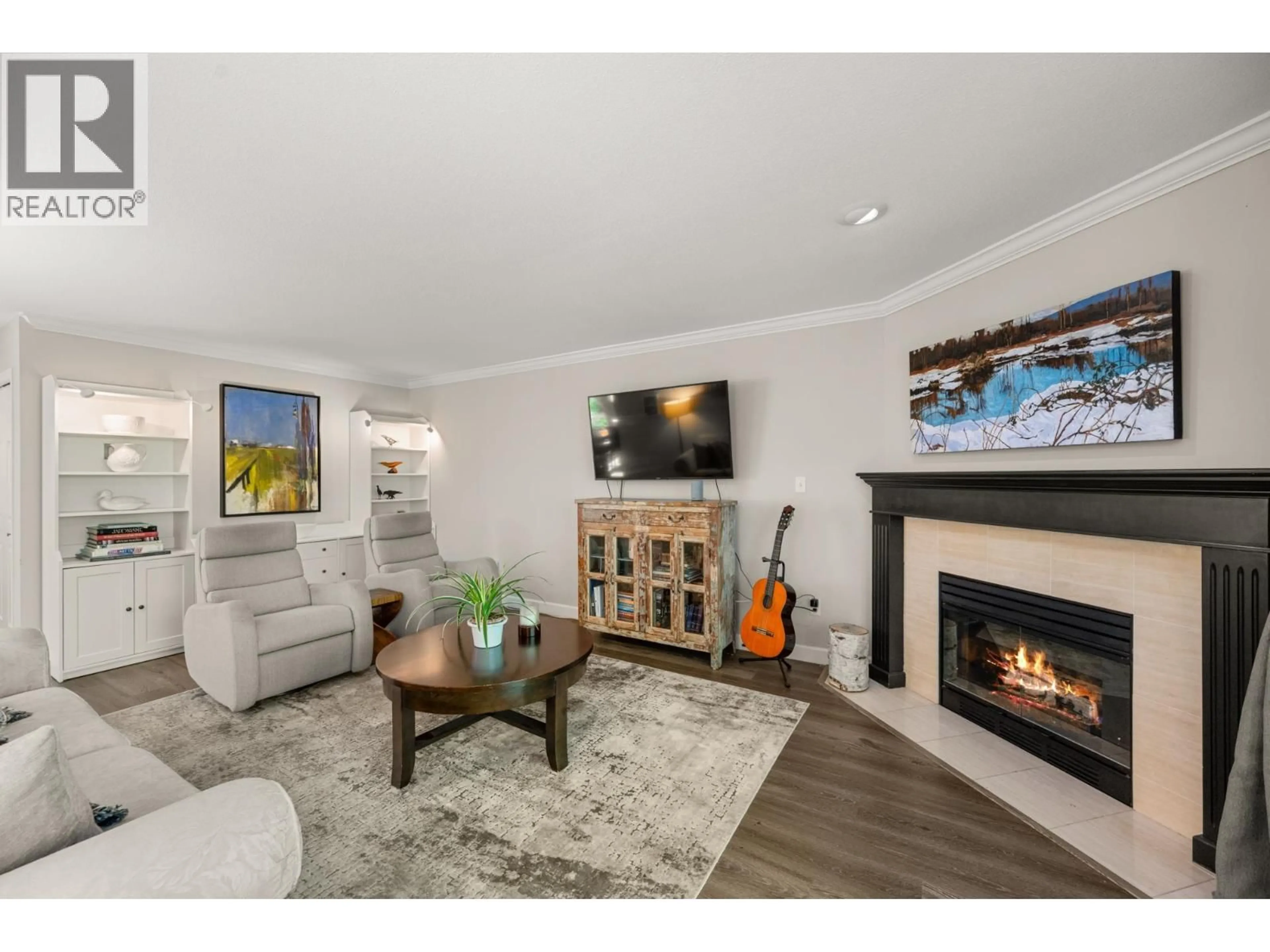 Living room with furniture, wood/laminate floor for 14 - 72 JAMIESON COURT, New Westminster British Columbia V3L5R6