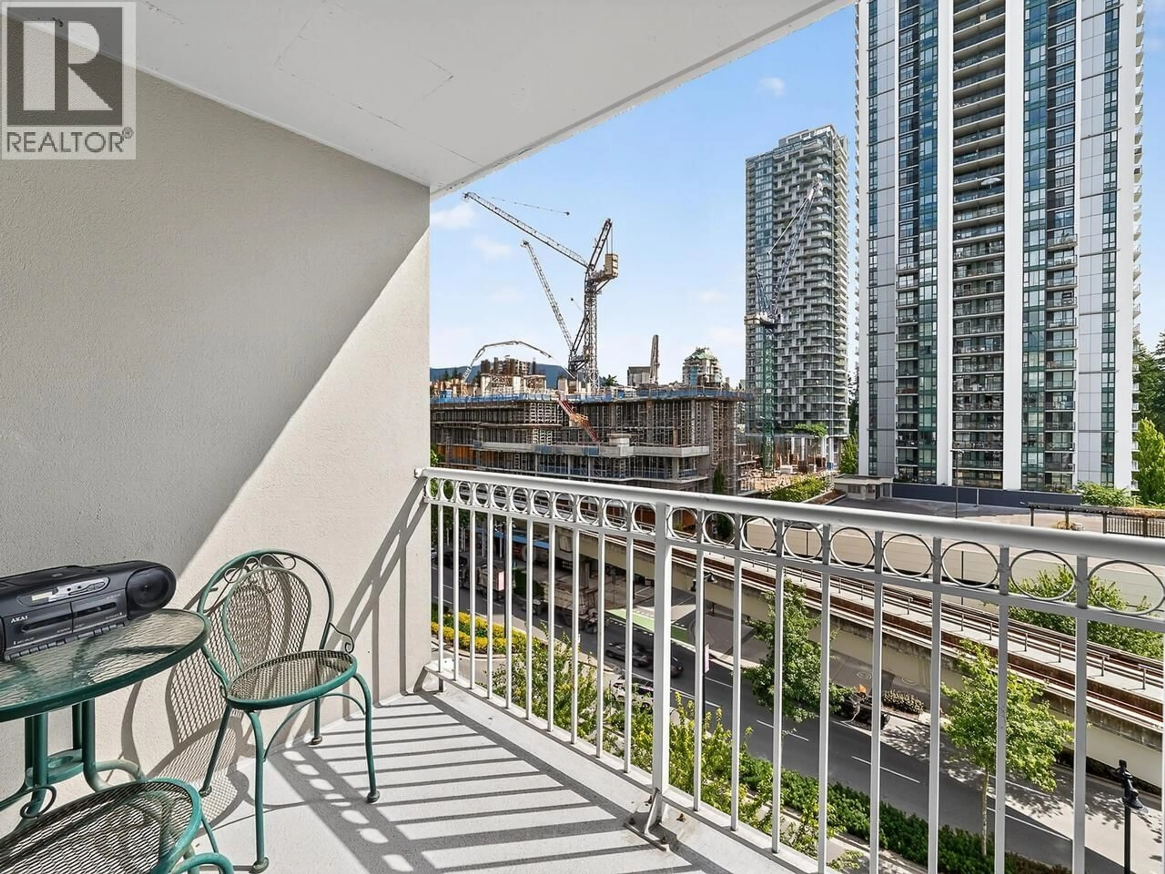 Balcony in the apartment, city buildings view from balcony for 707 - 1180 PINETREE WAY, Coquitlam British Columbia V3B7L2