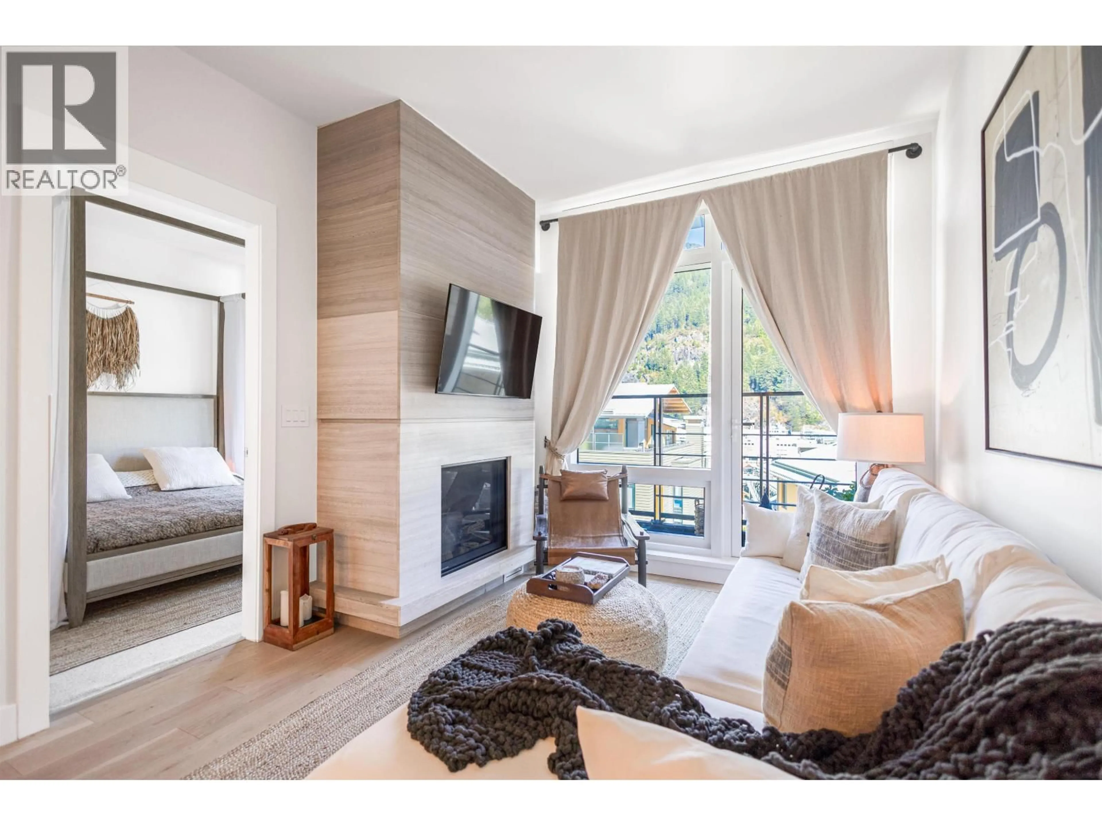 Living room with furniture, wood/laminate floor for 408 - 6687 NELSON AVENUE, West Vancouver British Columbia V7W2B2