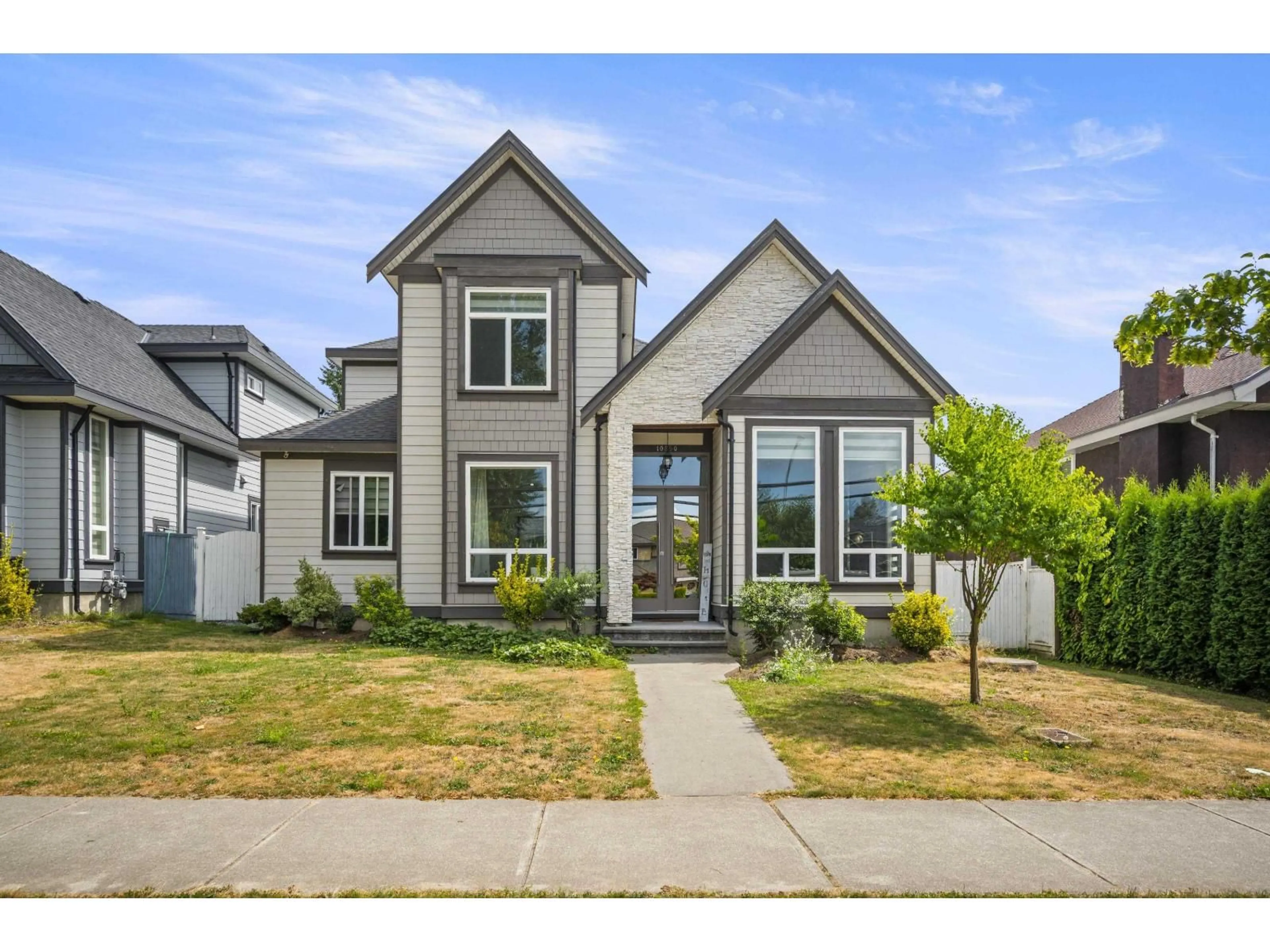 Home with brick exterior material, street for 10850 156 ST, Surrey British Columbia V3R6J6