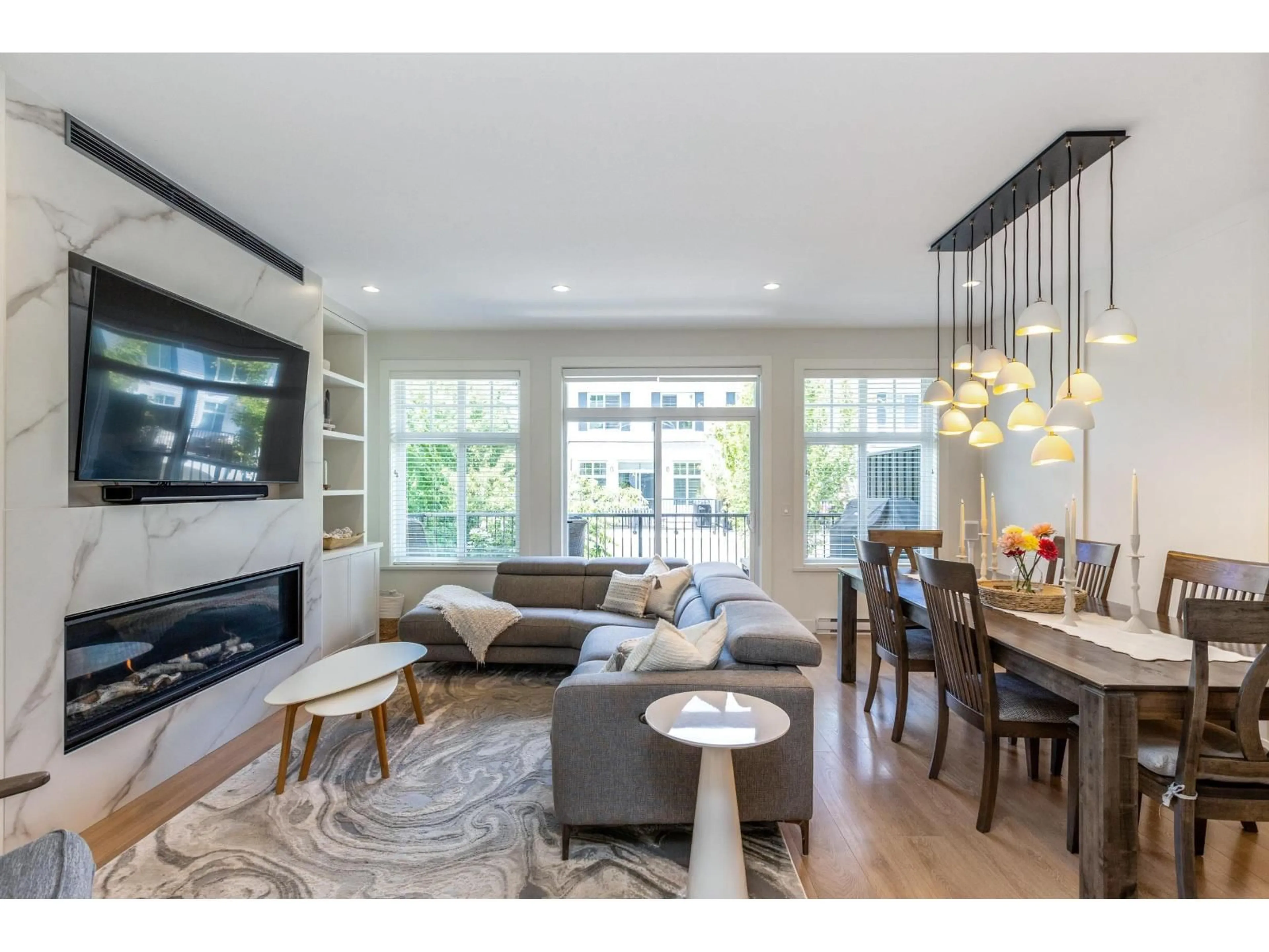 Living room with furniture, wood/laminate floor for 5 - 288 171, Surrey British Columbia V3Z9P5
