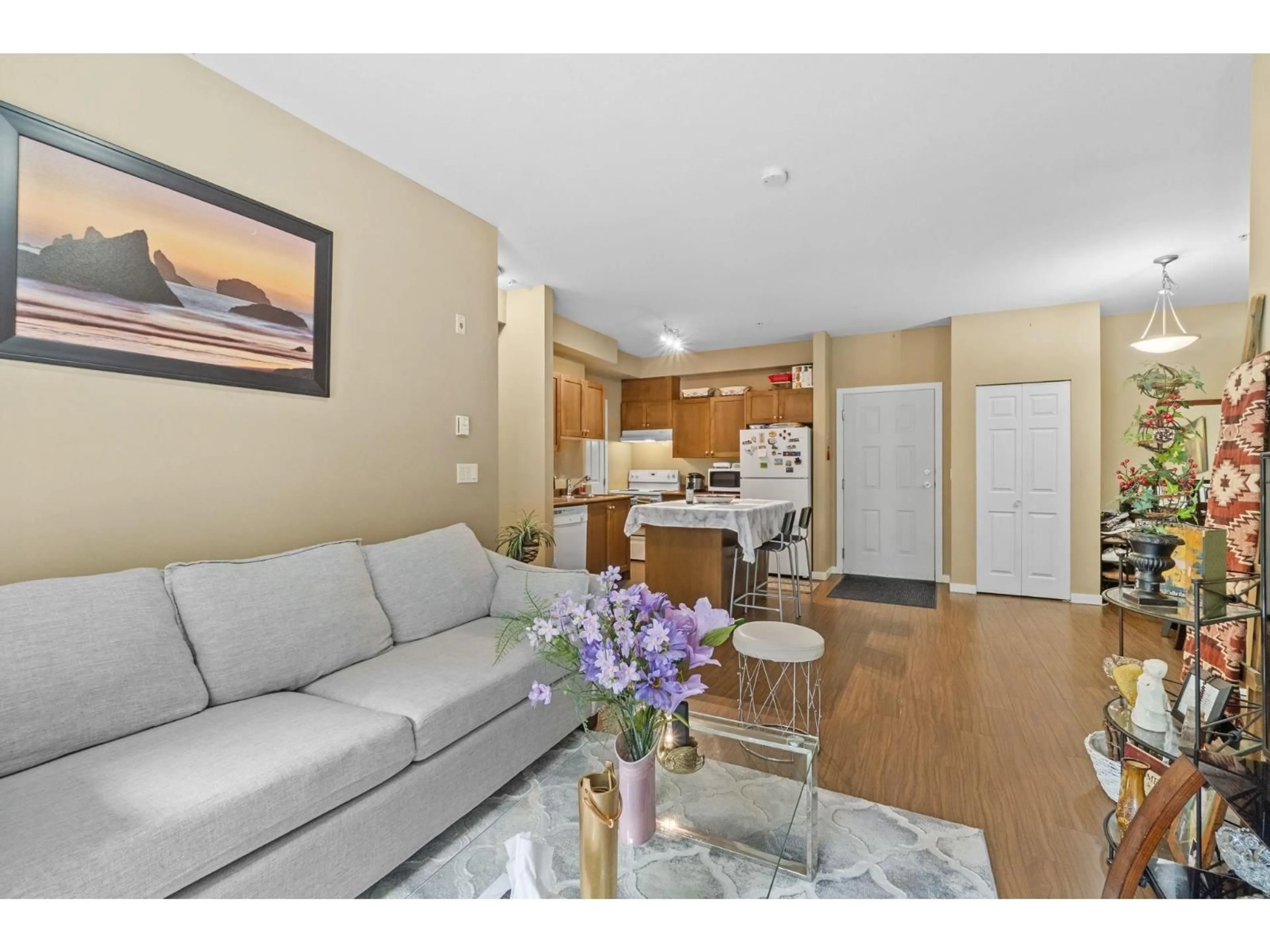 Living room with furniture, wood/laminate floor for 308 - 13277 108TH, Surrey British Columbia V3T0A9
