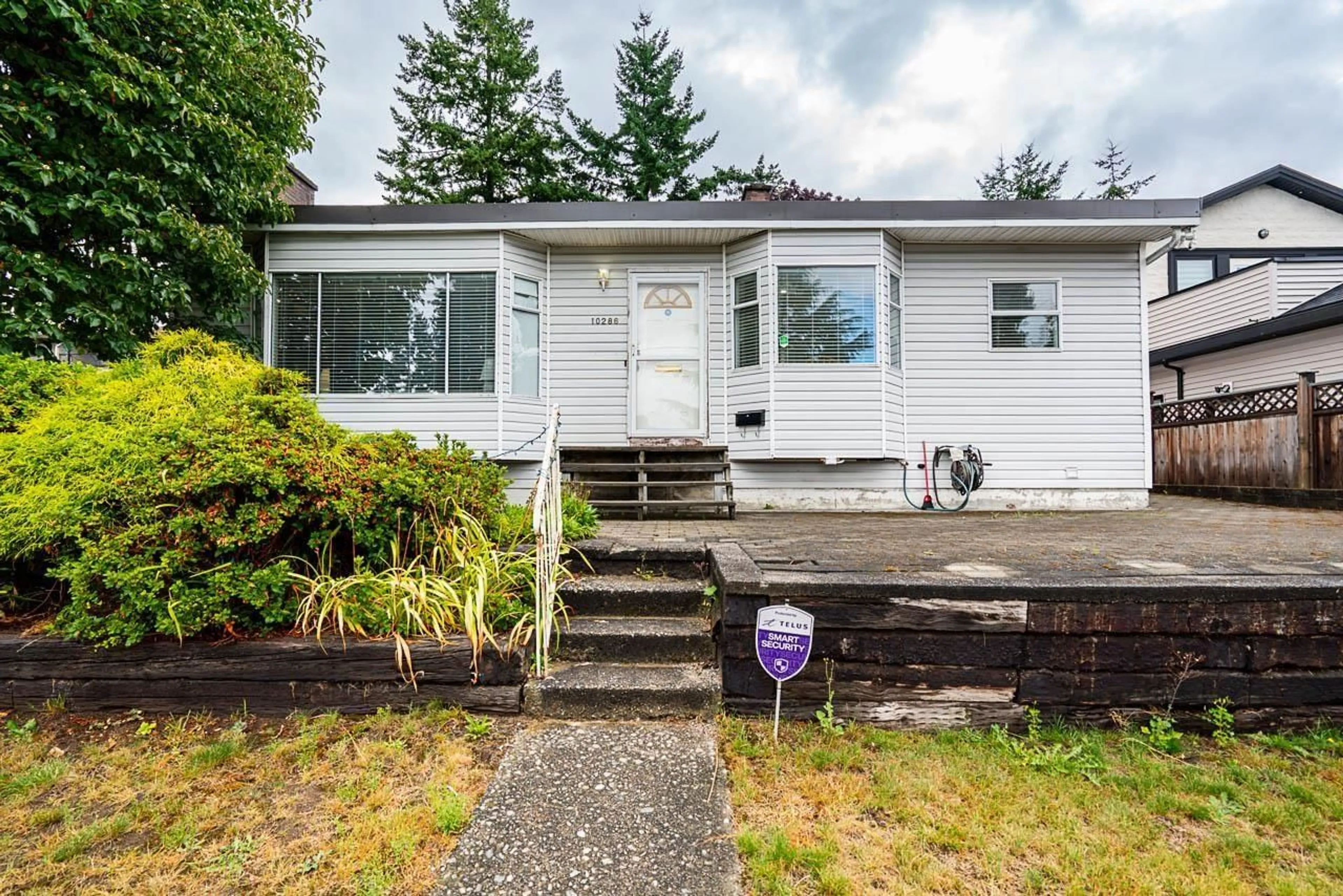 Home with vinyl exterior material, street for 10286 127, Surrey British Columbia V3V5J7