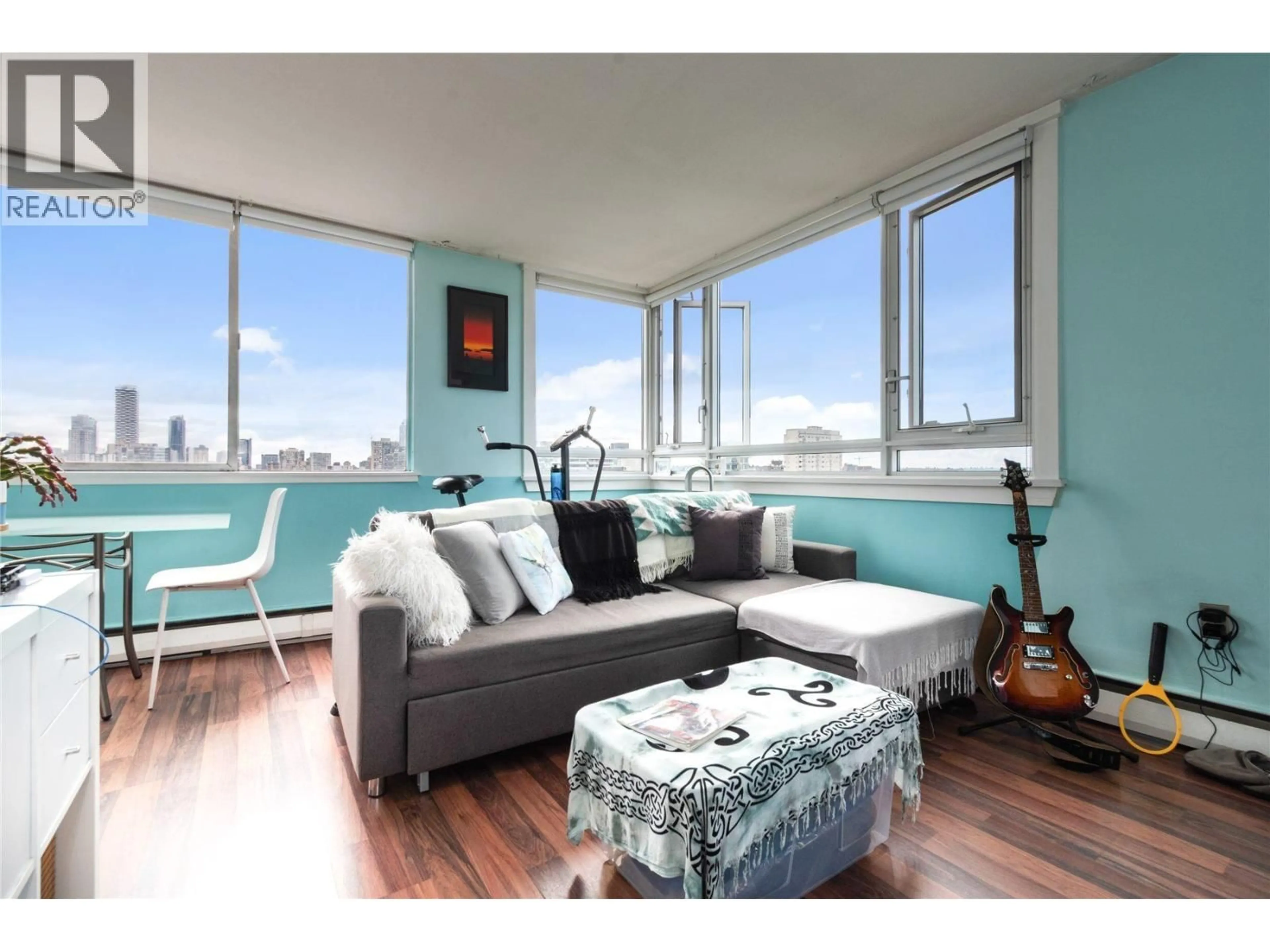 Living room with furniture, wood/laminate floor for 2402 - 1850 COMOX STREET, Vancouver British Columbia V6G1R3
