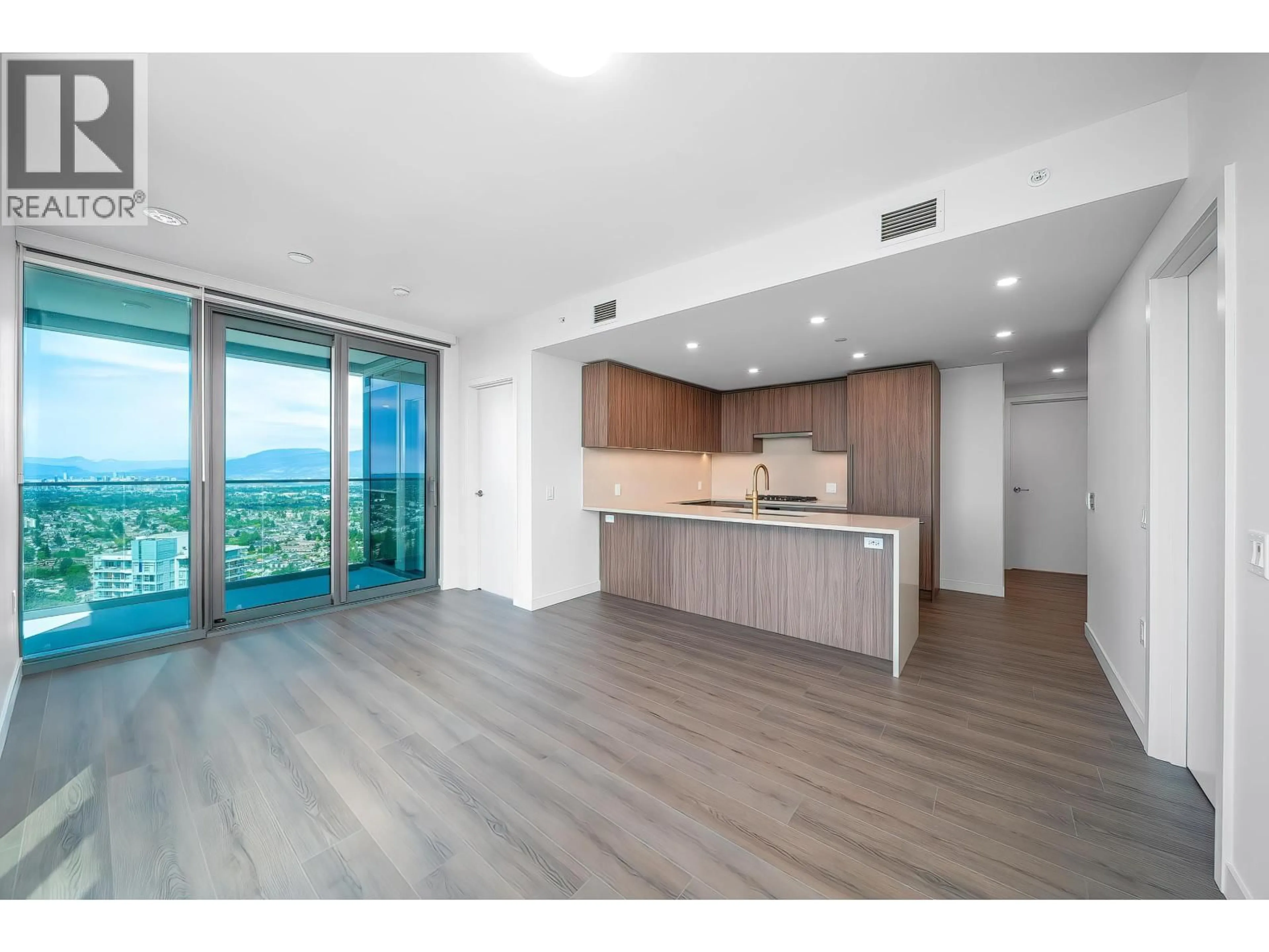 Open concept kitchen, wood/laminate floor for 3904 - 5987 WILSON AVENUE, Burnaby British Columbia V5H0L7