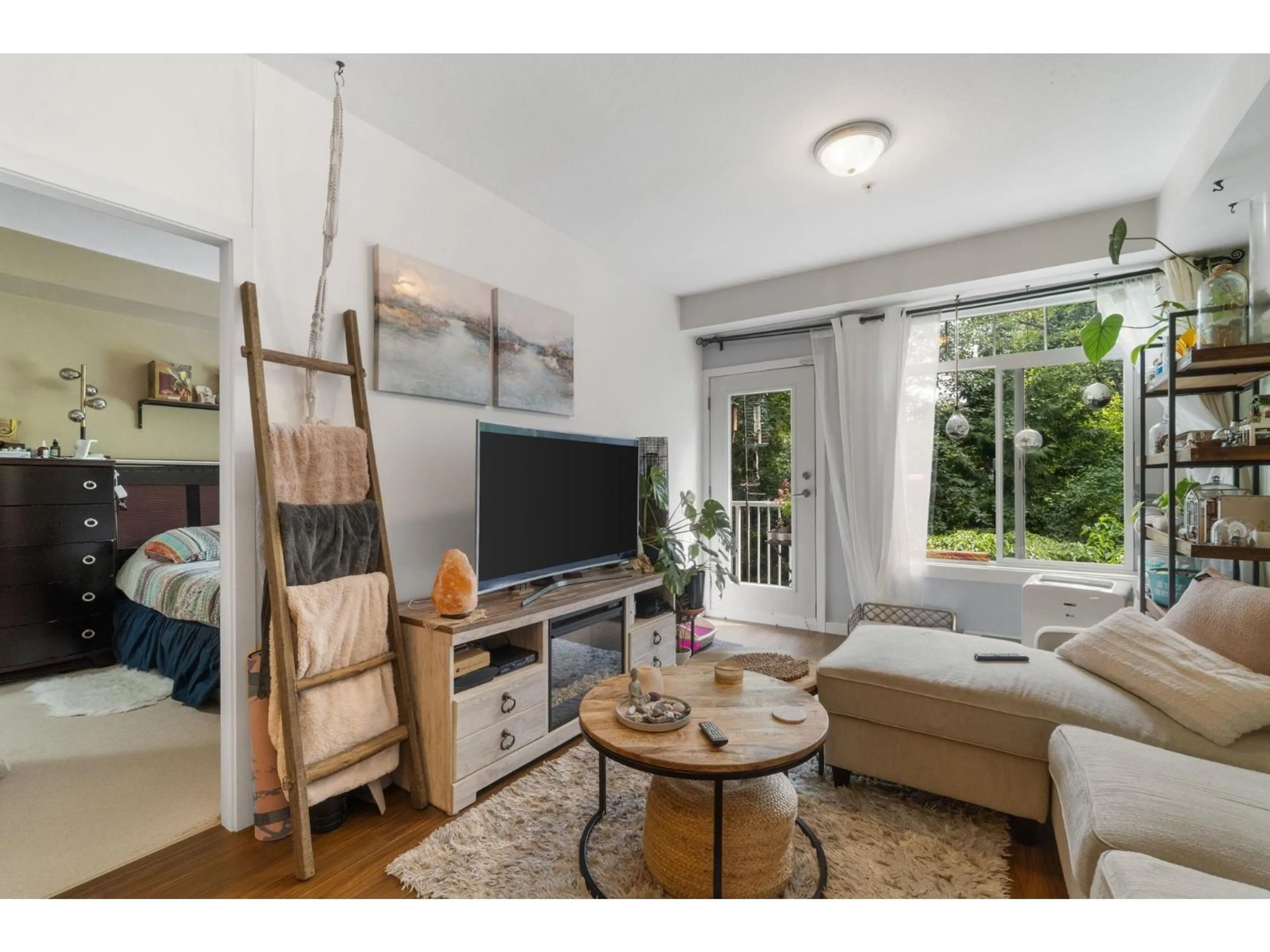 Living room with furniture, wood/laminate floor for 205 - 13277 108TH, Surrey British Columbia V3T0A9