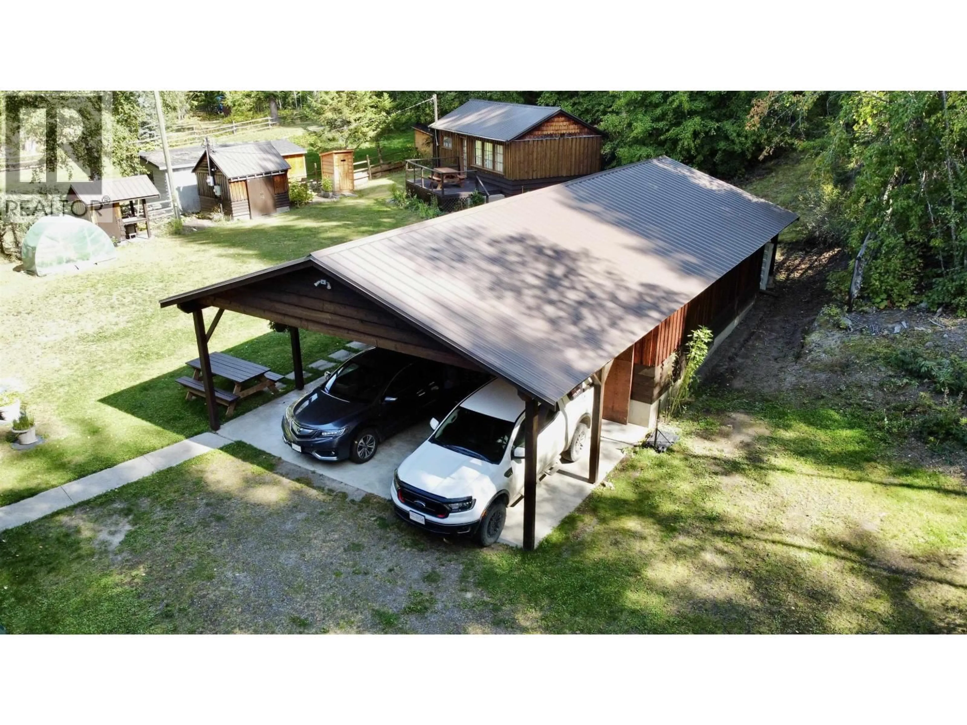 A pic from outside/outdoor area/front of a property/back of a property/a pic from drone, street for 3662 HIGGINS ROAD, Canim Lake British Columbia V0K1J0