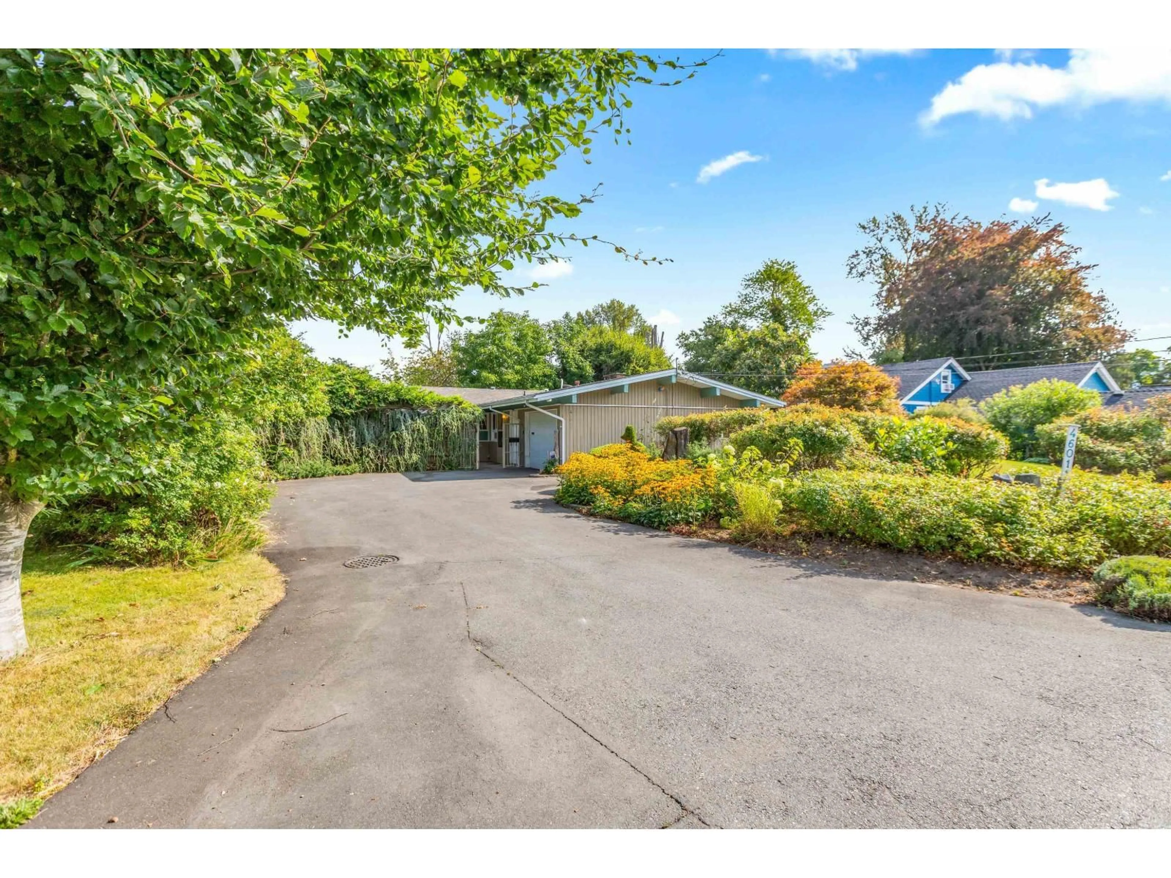 A pic from outside/outdoor area/front of a property/back of a property/a pic from drone, street for 46011 CLARKE DRIVE, Chilliwack British Columbia V2P3N5