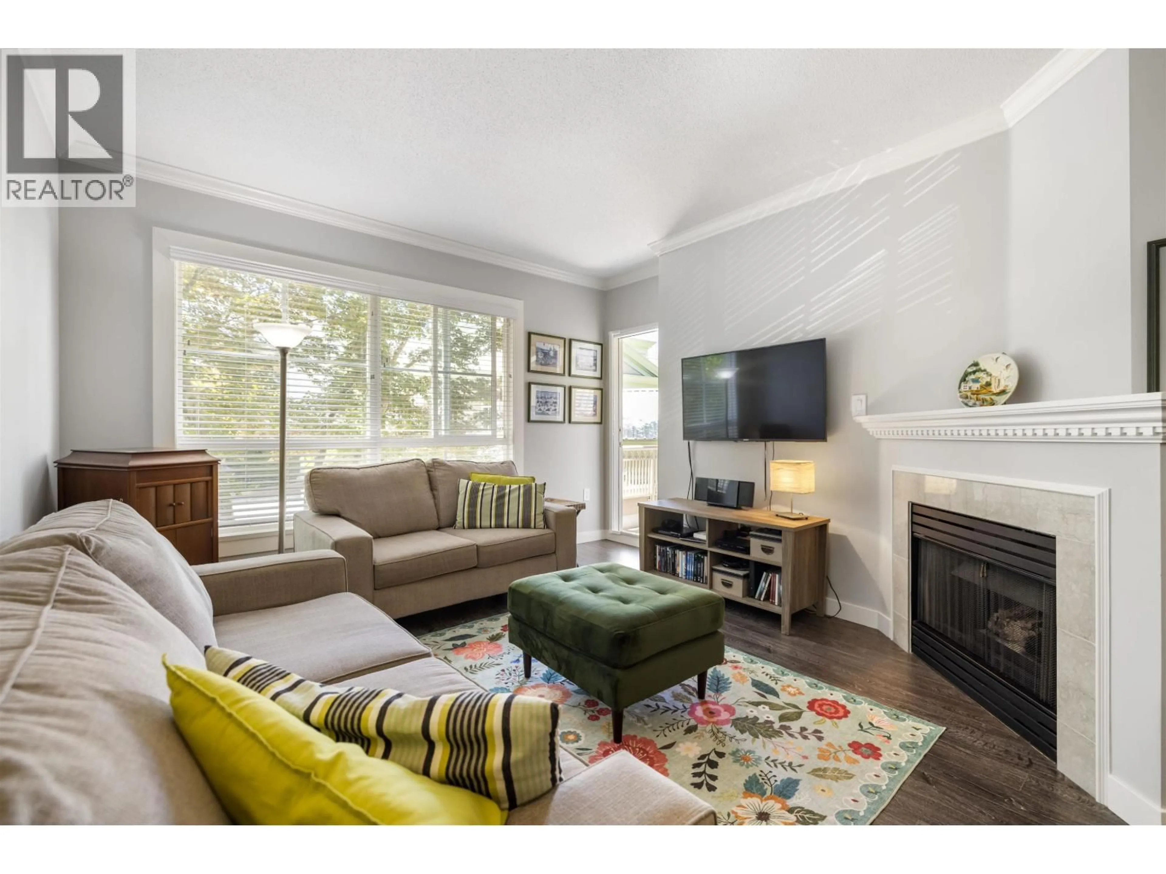 Living room with furniture, wood/laminate floor for 101 - 8975 JONES ROAD, Richmond British Columbia V6Y3Y7