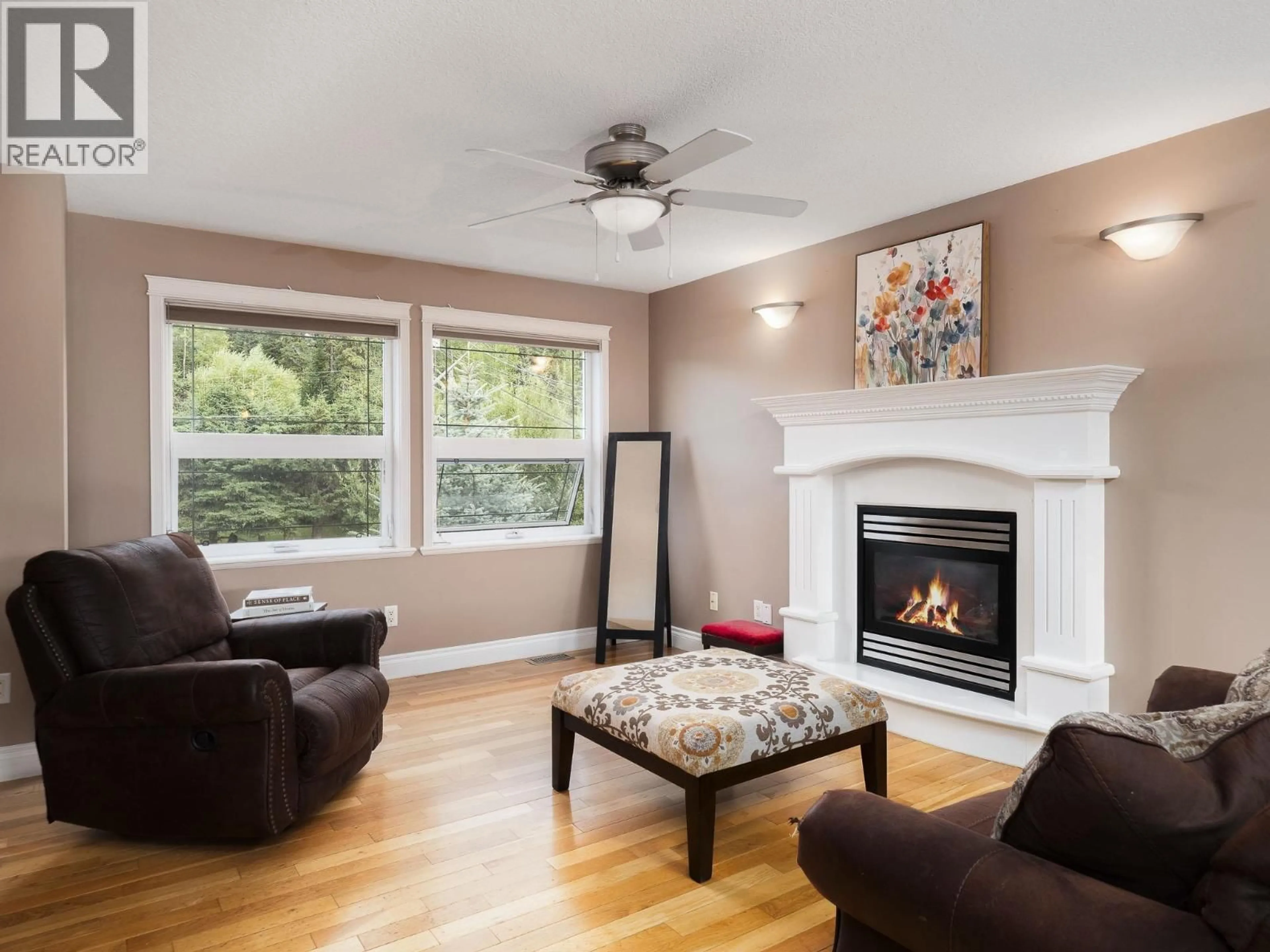 Living room with furniture, wood/laminate floor for 1957 BITTNER ROAD, Prince George British Columbia V2N6T3