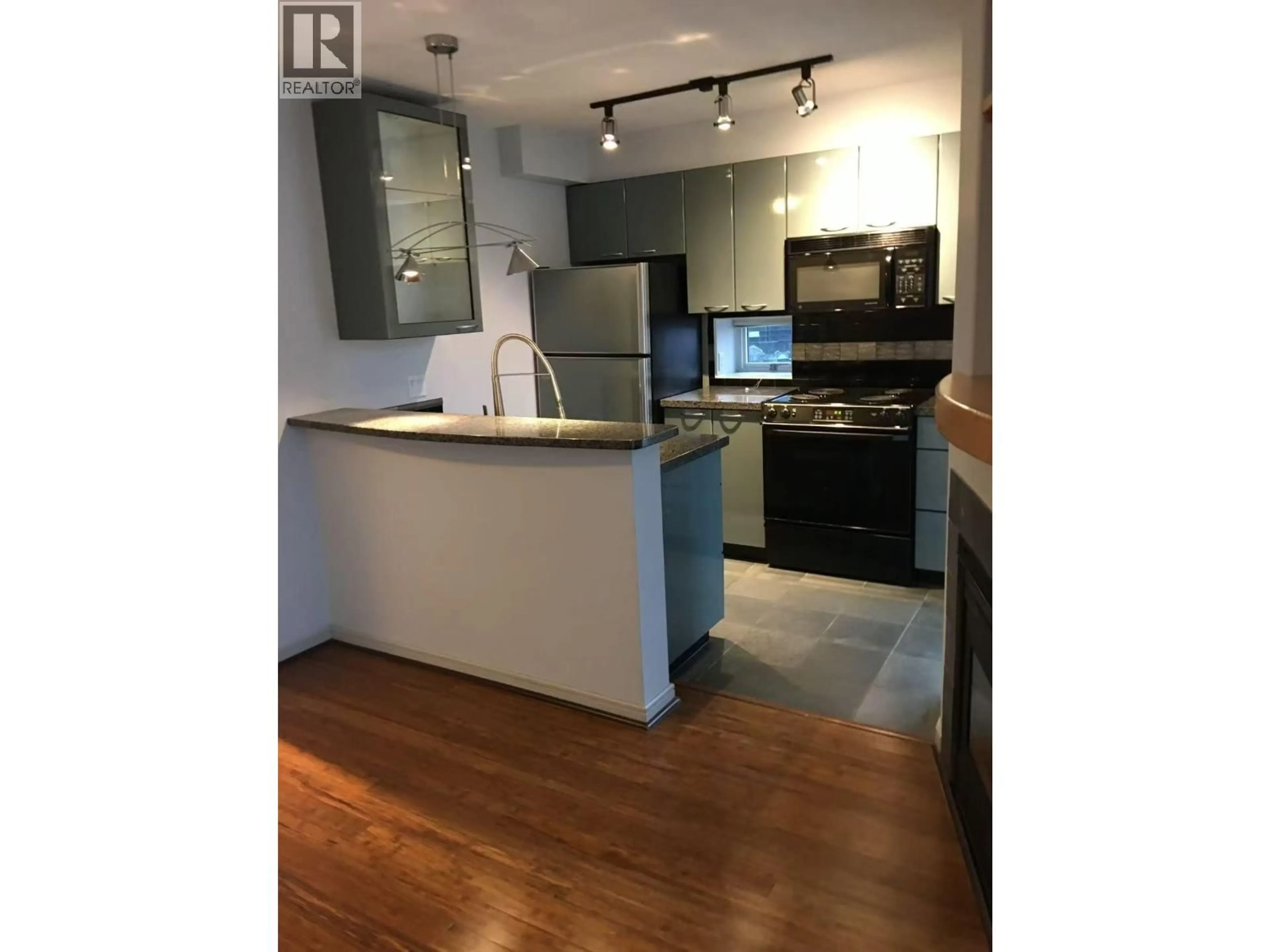 Open concept kitchen, wood/laminate floor for 1505 - 1068 HORNBY STREET, Vancouver British Columbia V6Z2Y7