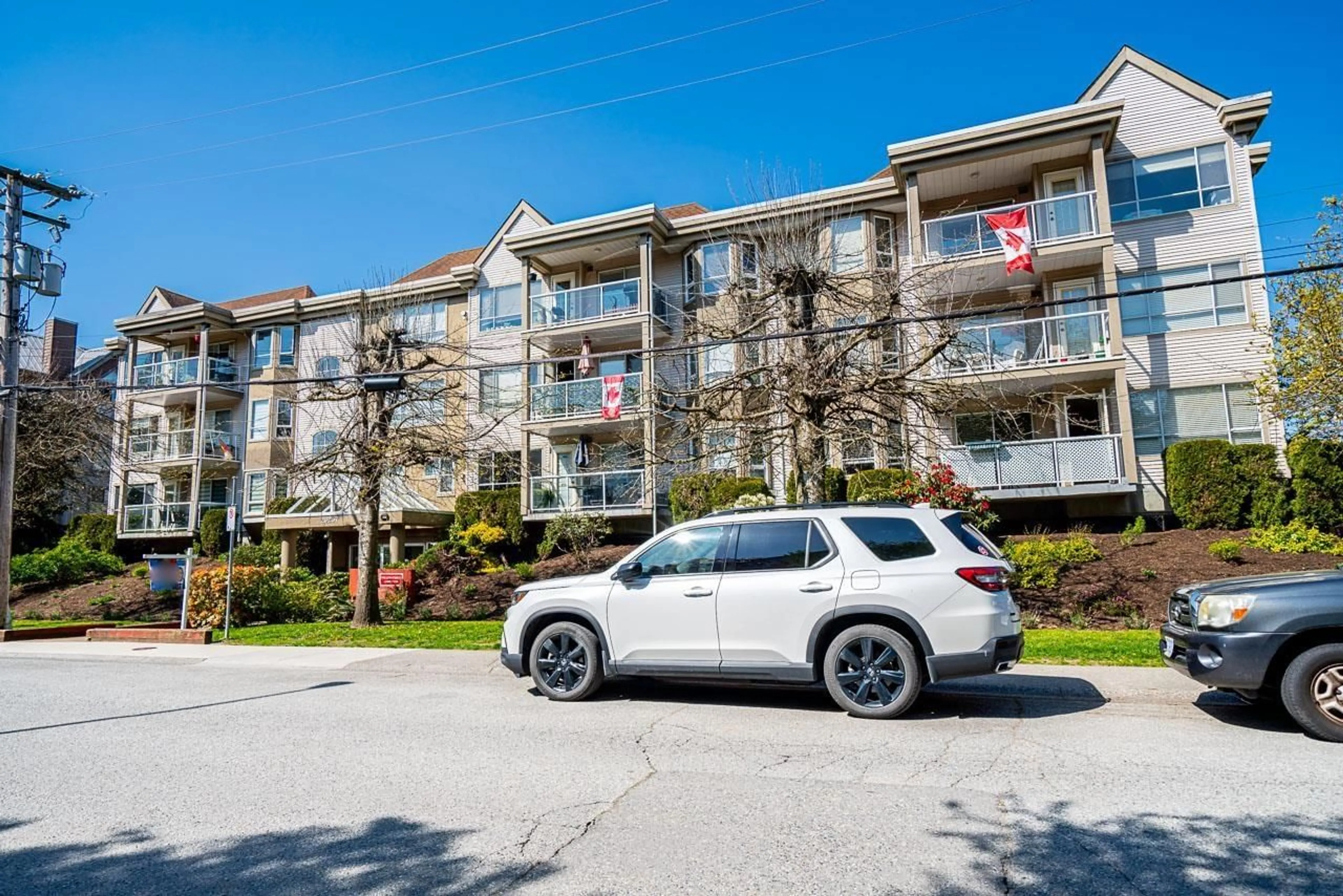 A pic from outside/outdoor area/front of a property/back of a property/a pic from drone, street for 306 - 20257 54, Langley British Columbia V3A3W2