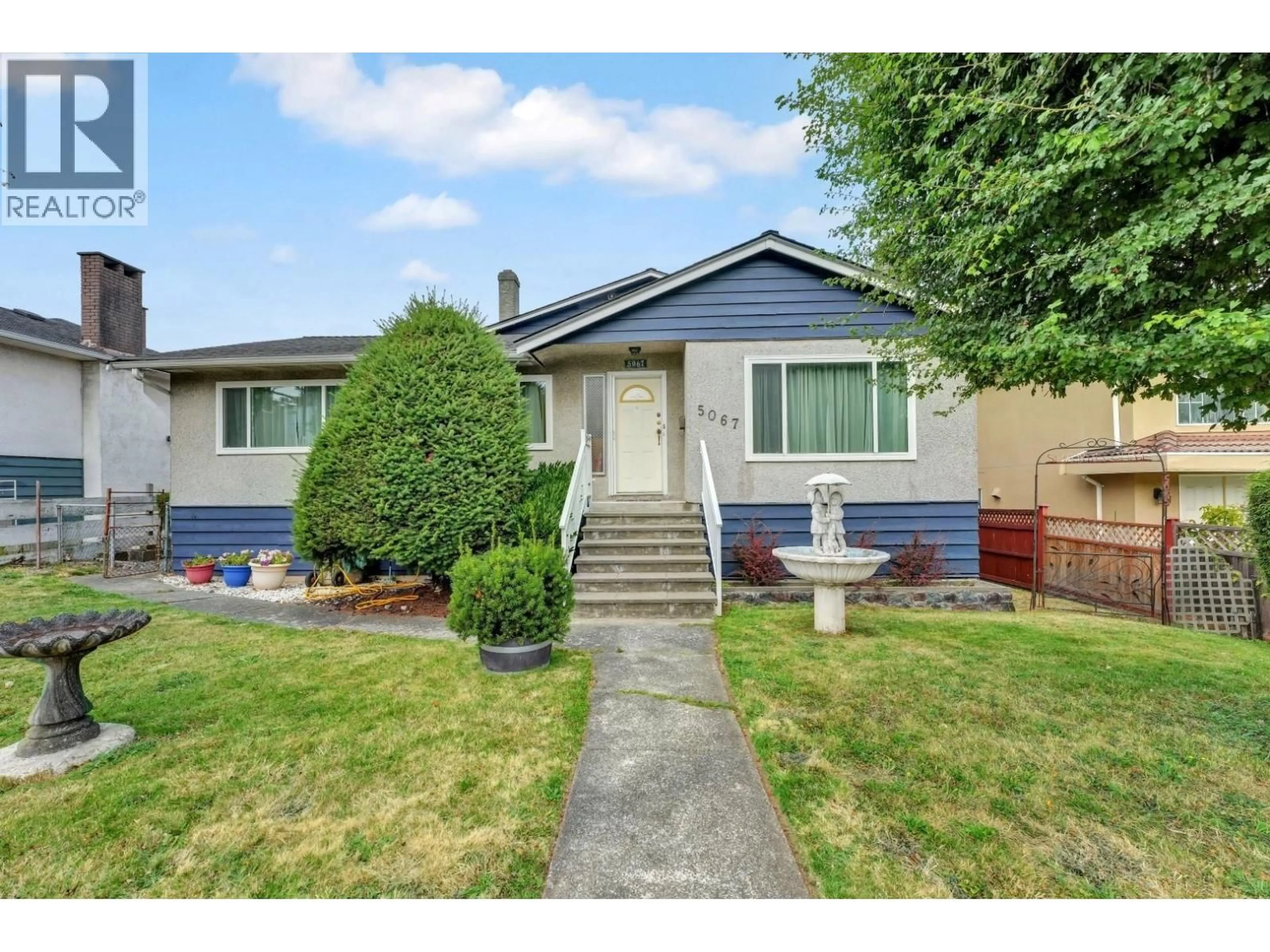Home with vinyl exterior material, street for 5067 DOVER STREET, Burnaby British Columbia V5H1R4