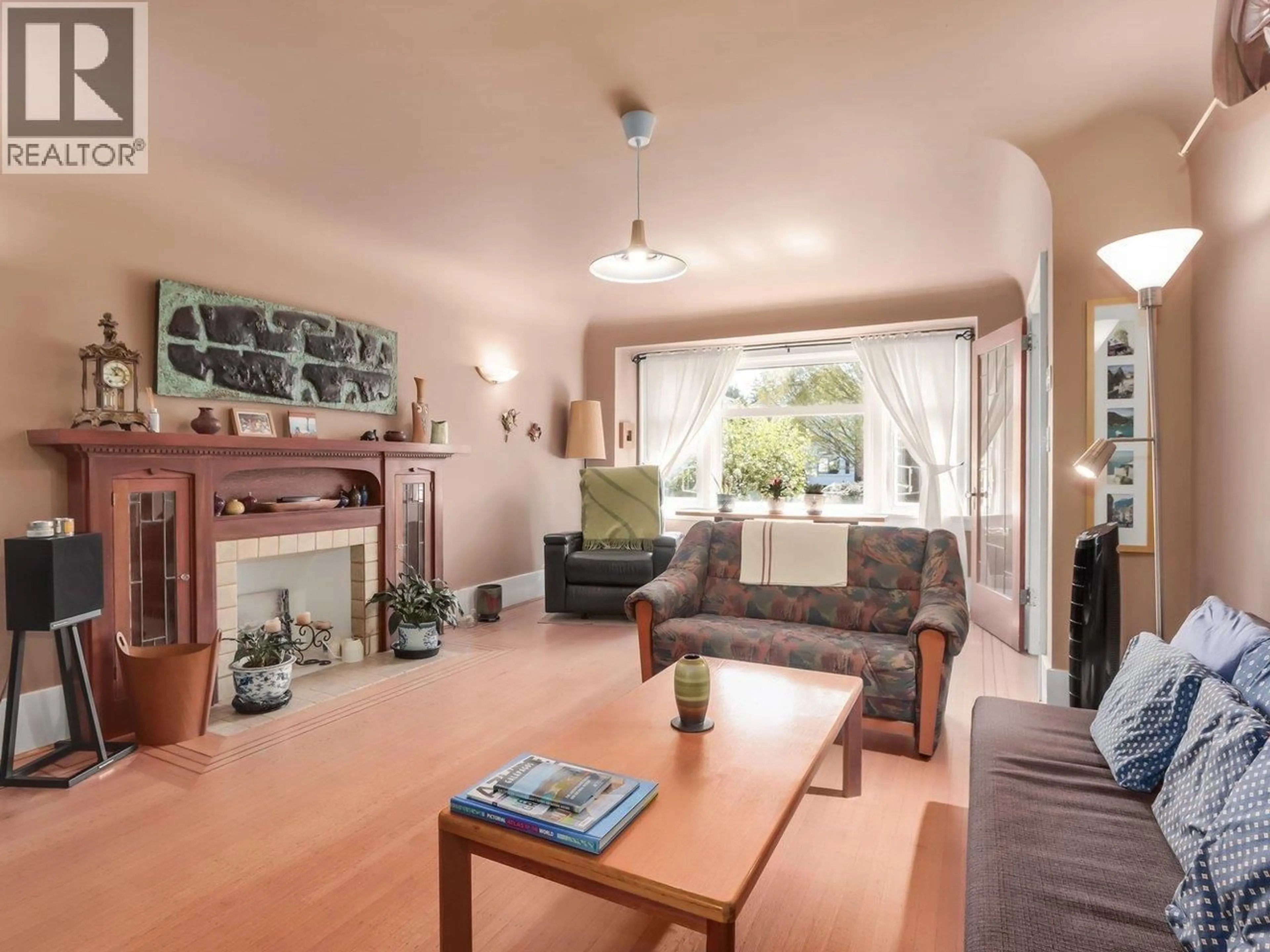 Living room with furniture, wood/laminate floor for 4529 8TH AVENUE, Vancouver British Columbia V6R2A4