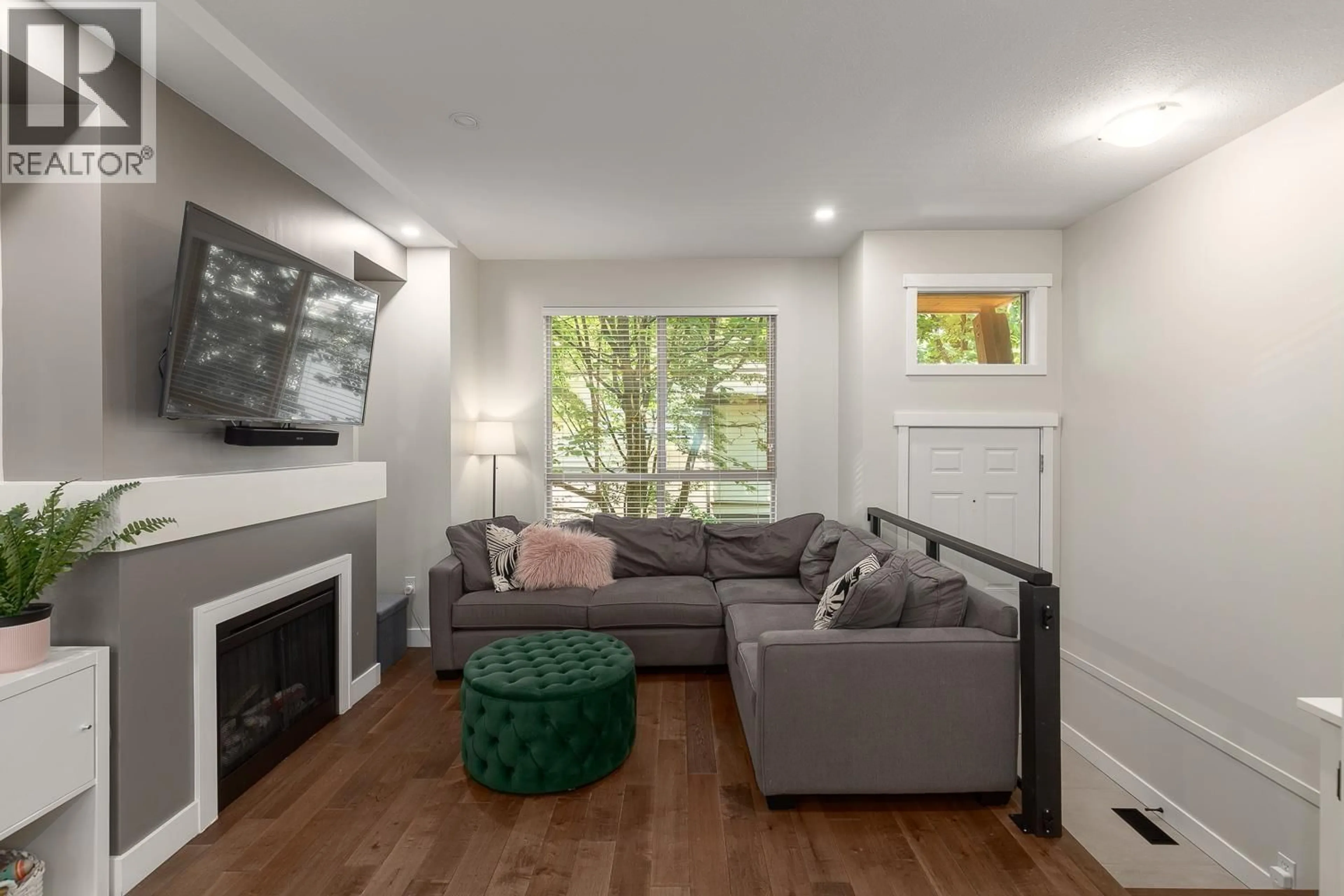 Living room with furniture, wood/laminate floor for 113 - 100 KLAHANIE DRIVE, Port Moody British Columbia V3H5K3