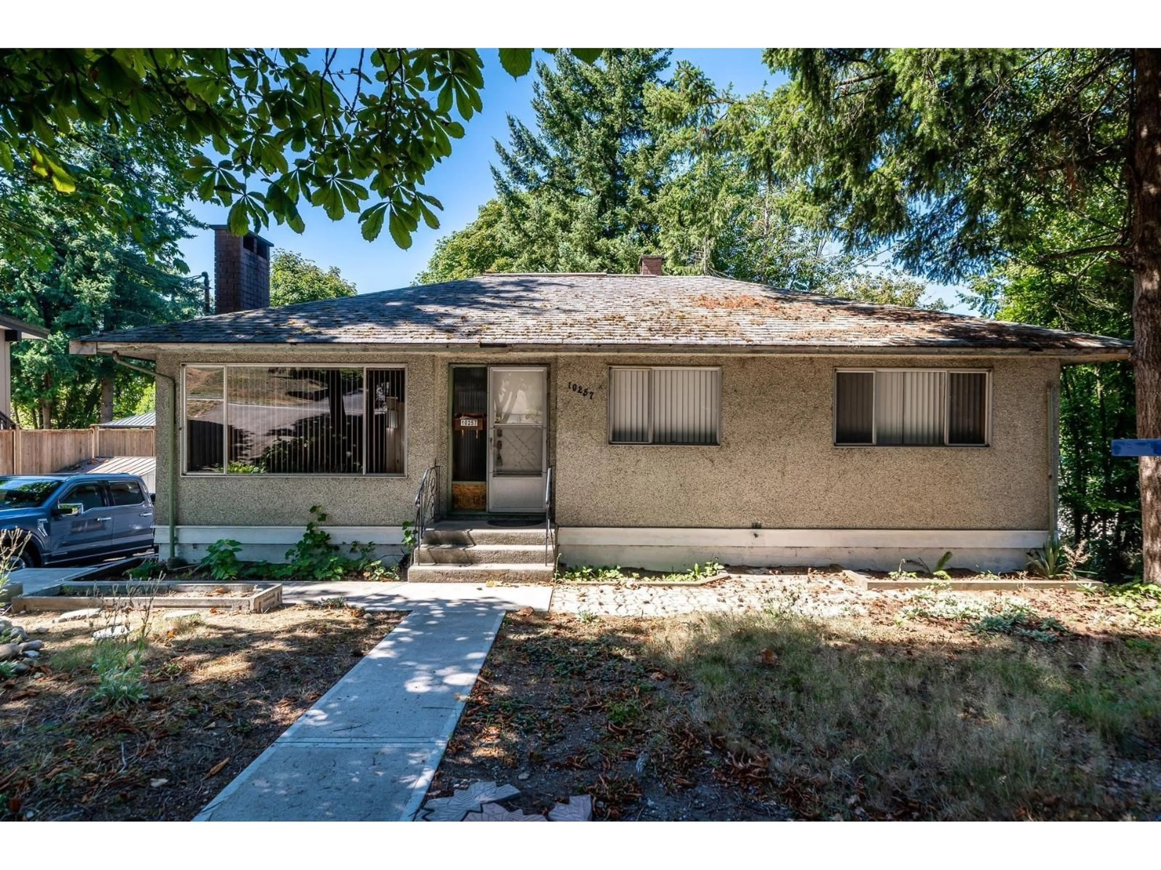 Home with vinyl exterior material, street for 10257 124, Surrey British Columbia V3V4T4