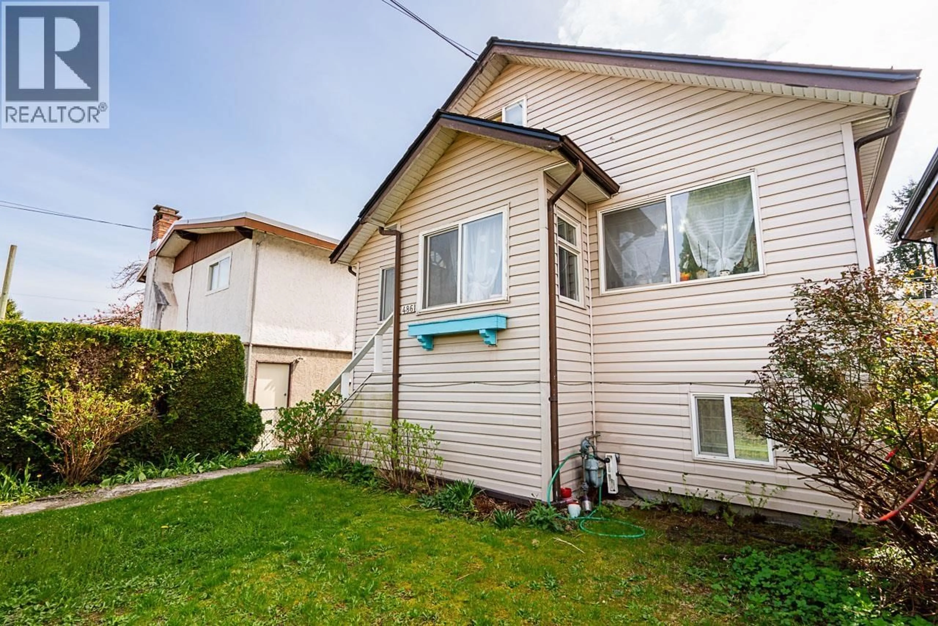 Home with vinyl exterior material, street for 486 KING EDWARD AVENUE, Vancouver British Columbia V5V2C8