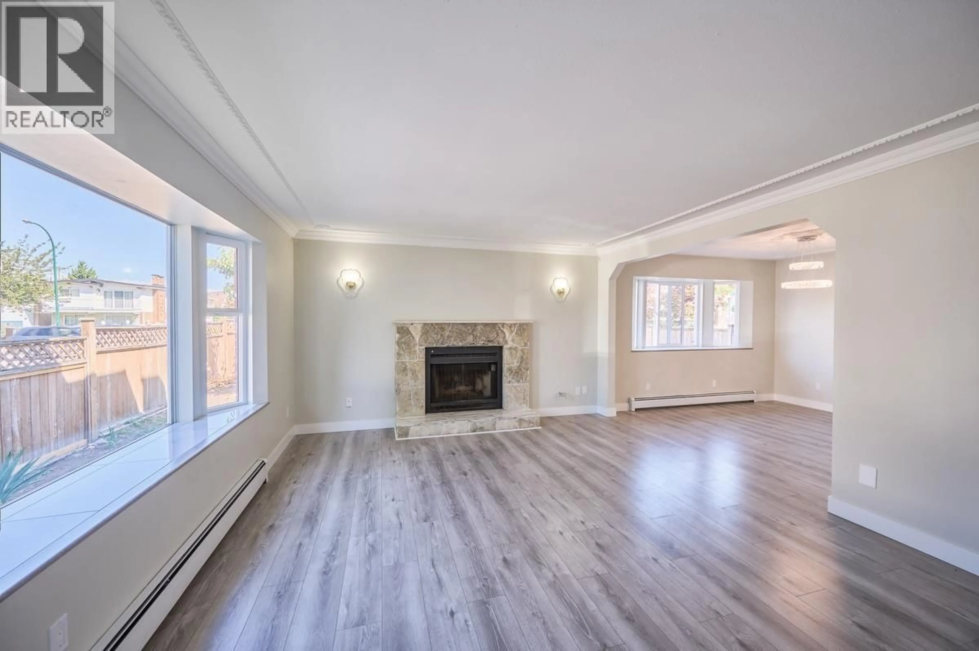 Living room with furniture, wood/laminate floor for 3288 26TH AVENUE, Vancouver British Columbia V5R1L7