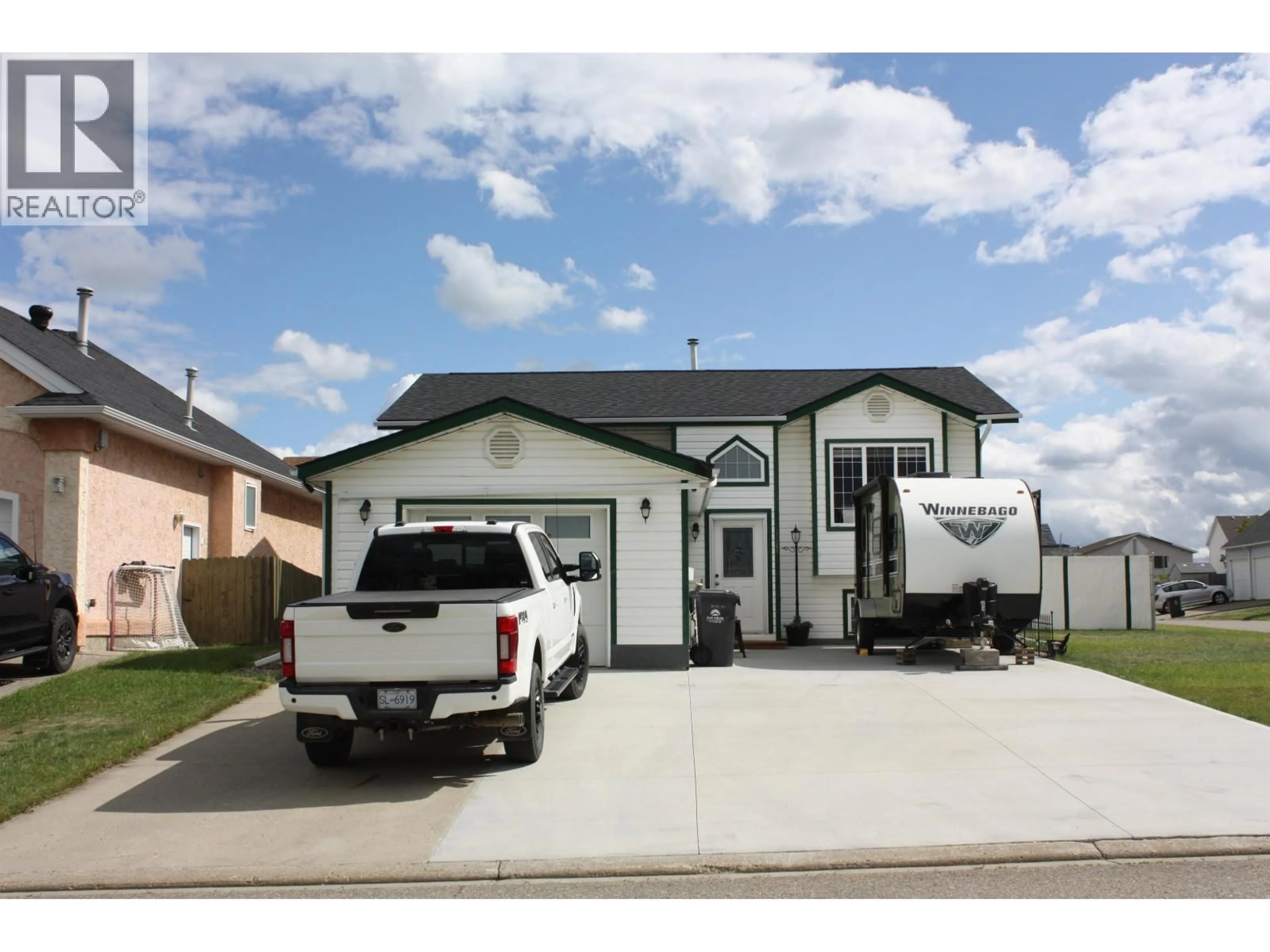 Home with vinyl exterior material, street for 11323 90 STREET, Fort St. John British Columbia V1J6R2