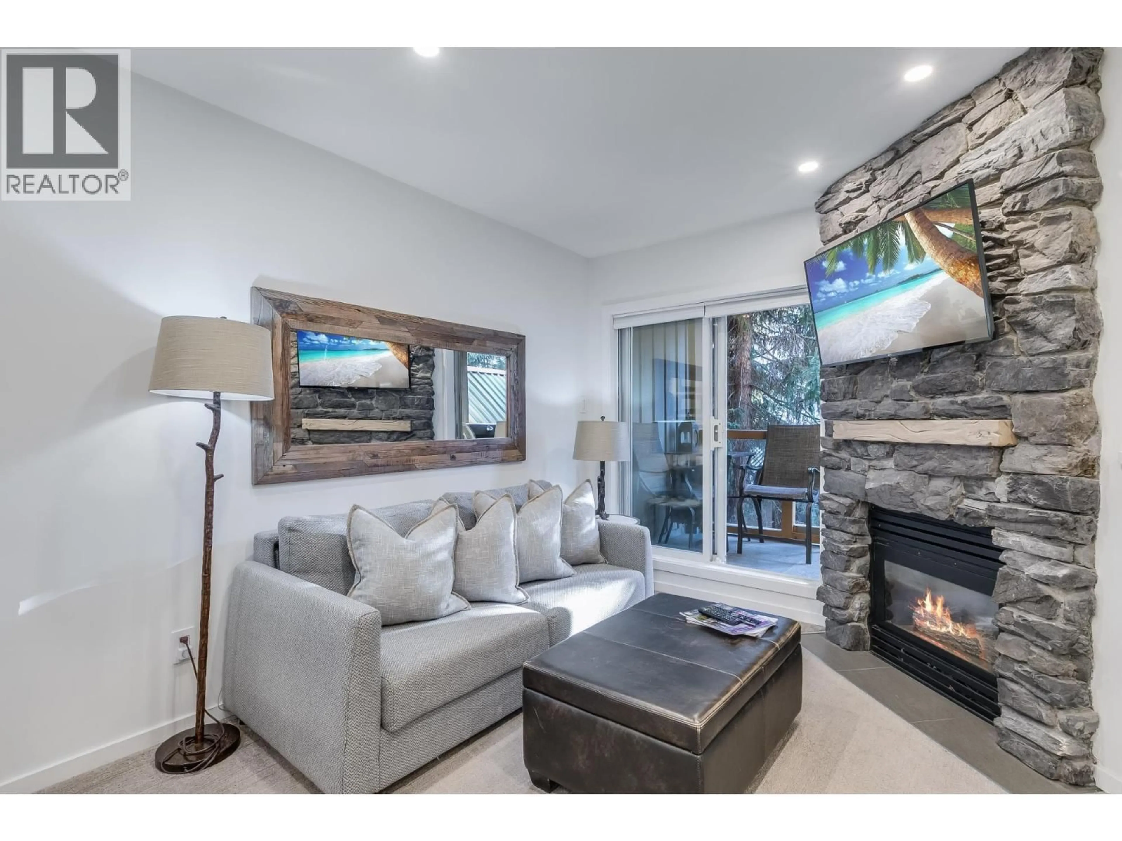 Living room with furniture, wood/laminate floor for 63 - 4388 NORTHLANDS BOULEVARD, Whistler British Columbia V8E1C6