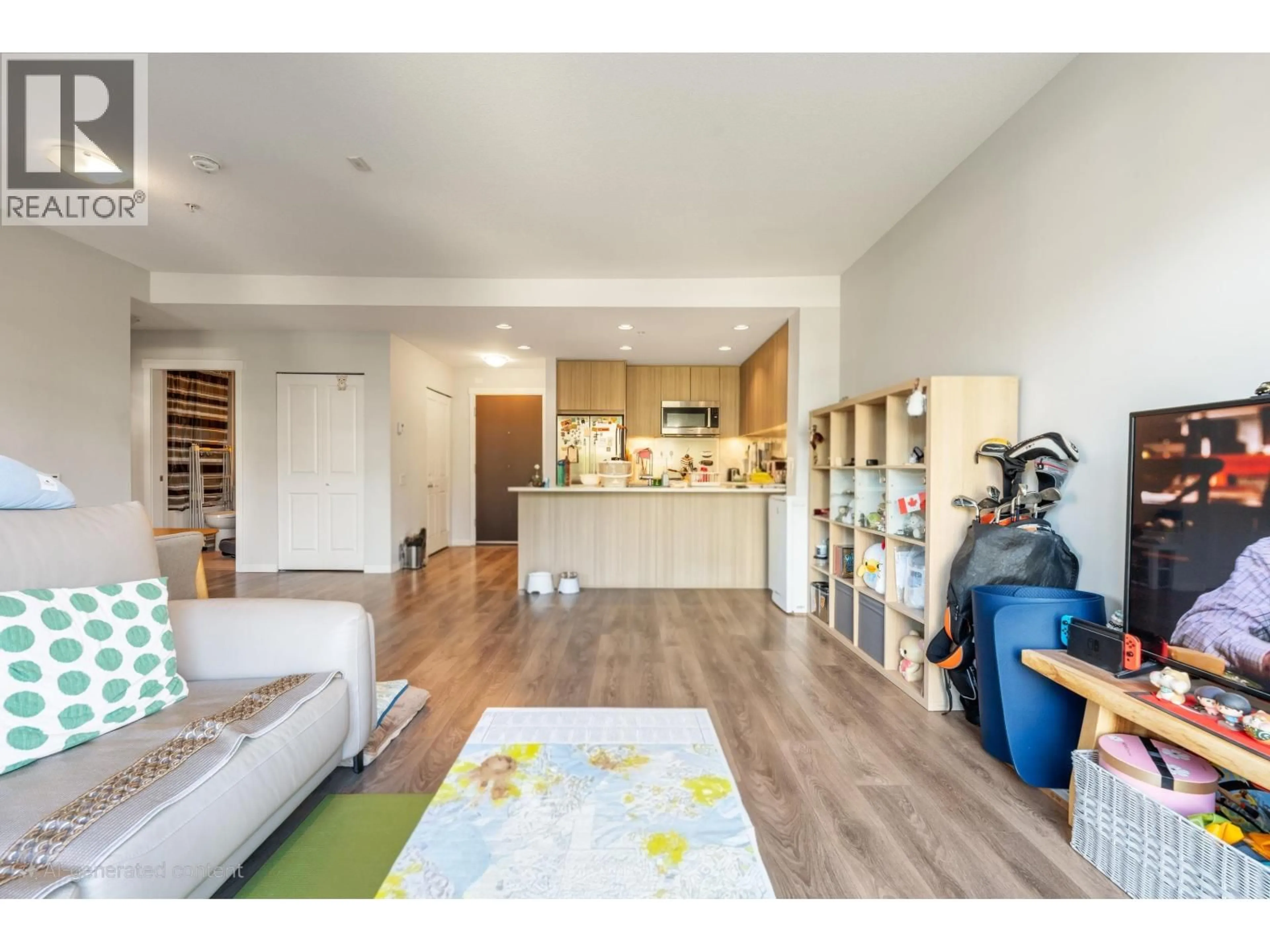 Living room with furniture, wood/laminate floor for 314 - 3289 RIVERWALK AVENUE, Vancouver British Columbia V5S0G2