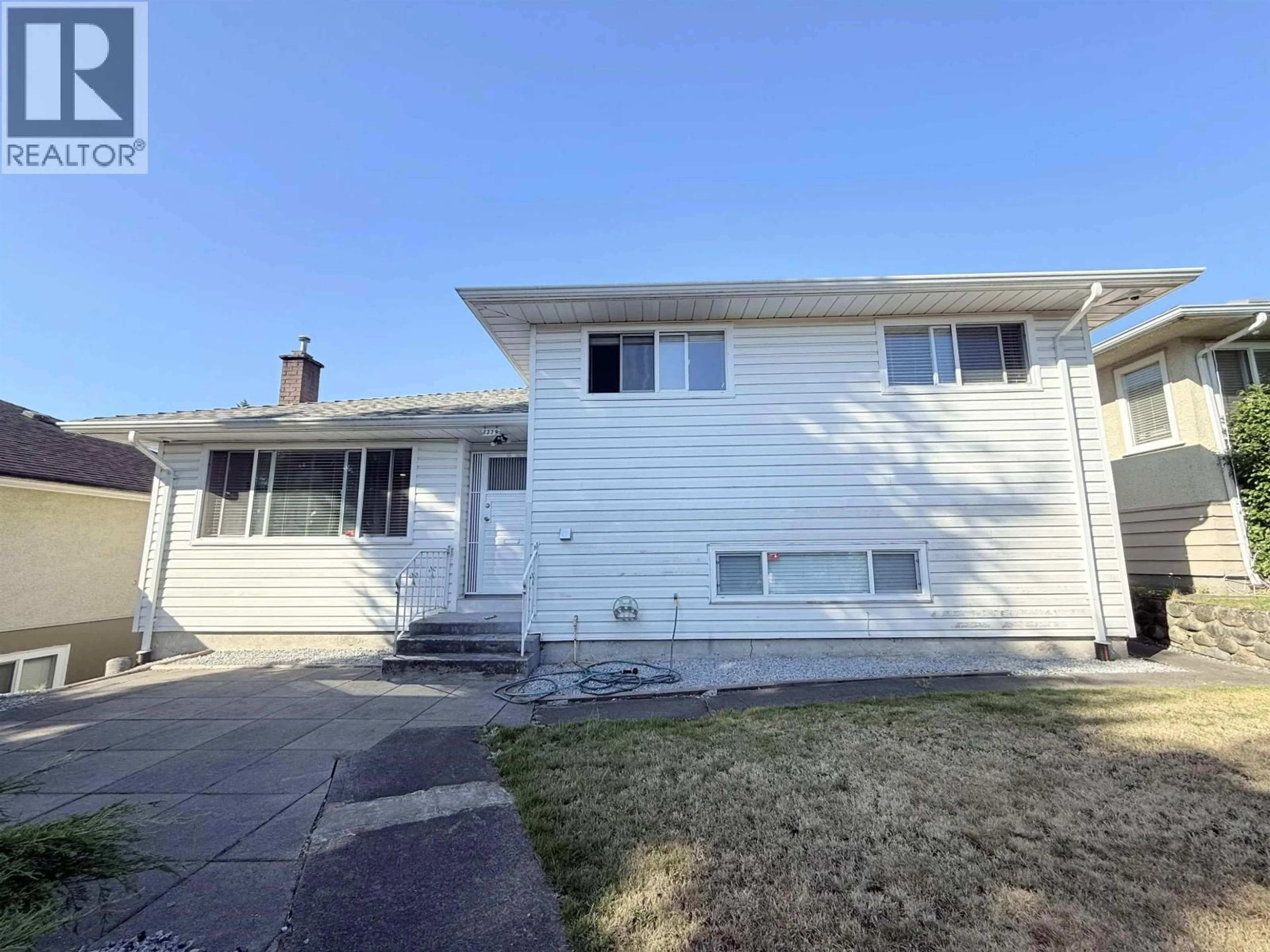 Home with vinyl exterior material, street for 7779 ELFORD STREET, Burnaby British Columbia V3N4B6