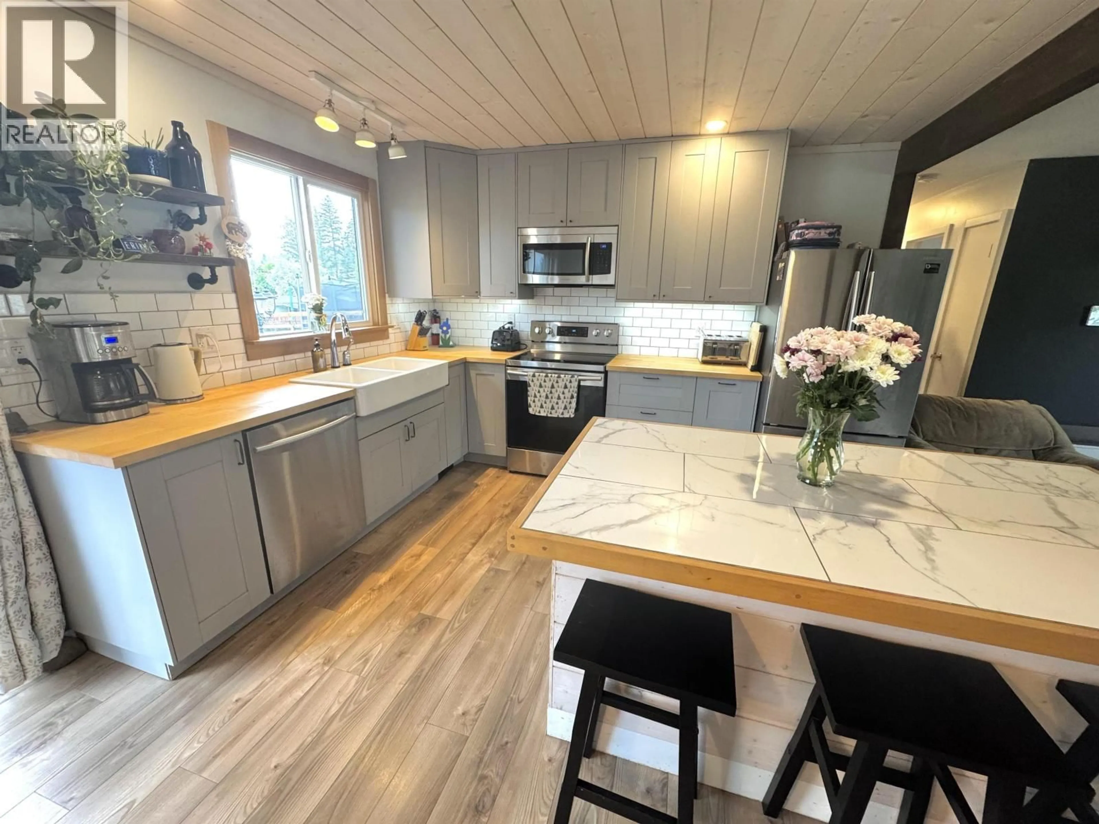 Open concept kitchen, wood/laminate floor for 721 PIGEON AVENUE, Williams Lake British Columbia V2G2B4