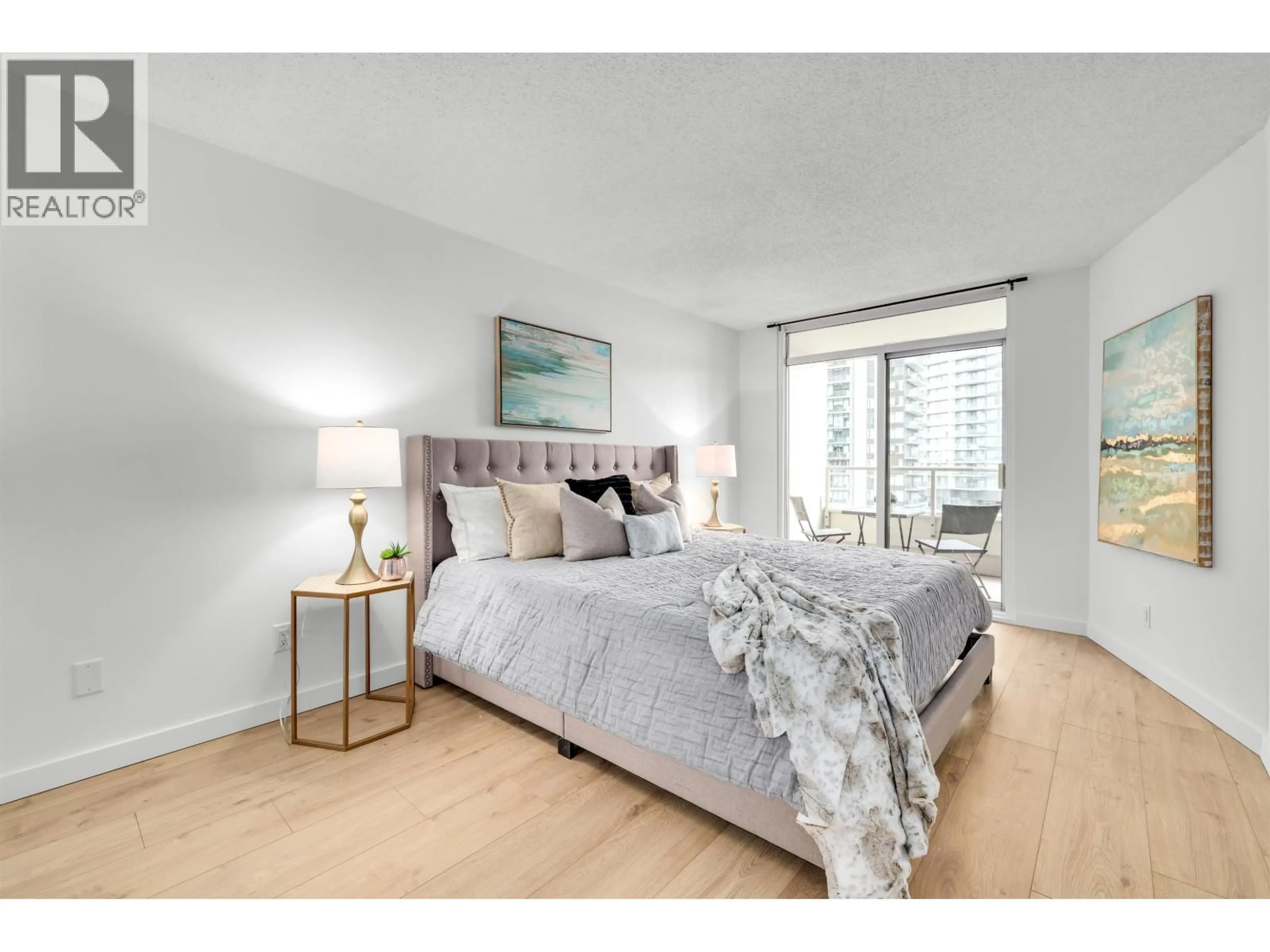 Bedroom with bed, wood/laminate floor for 905 - 6070 MCMURRAY AVENUE, Burnaby British Columbia V5H4J3